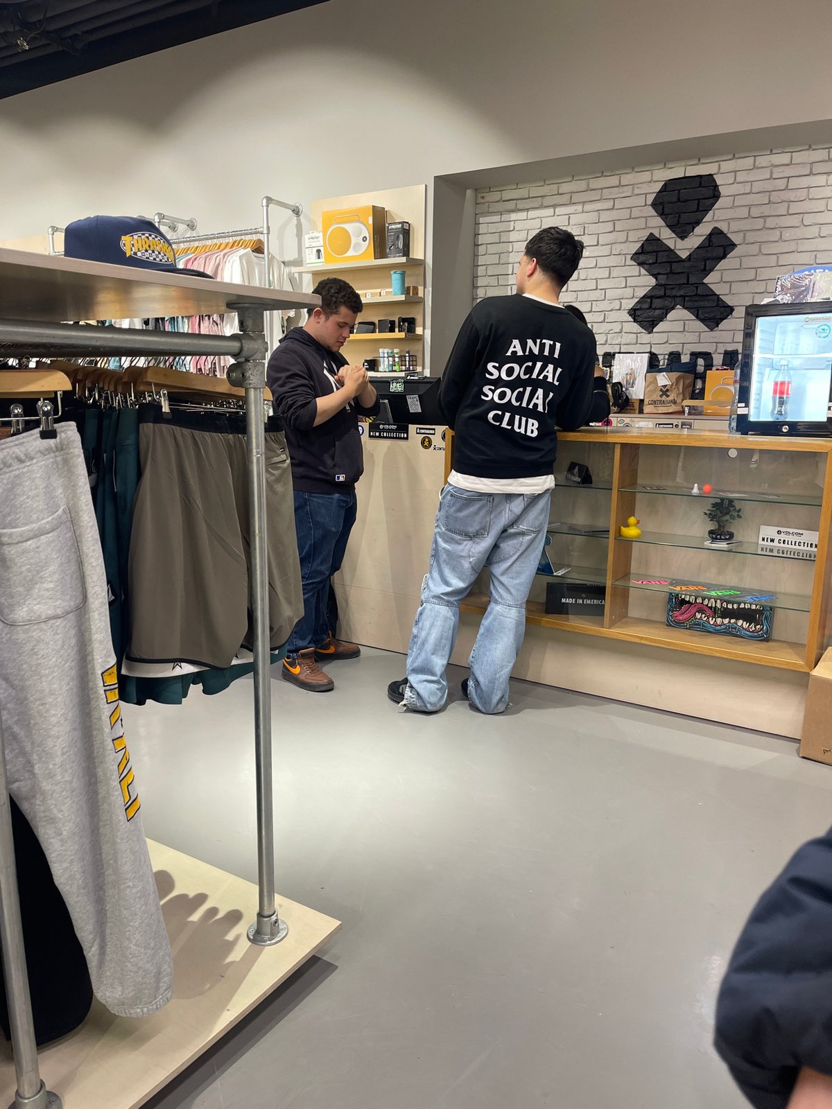Shoppers browse clothing store and eat in Sofia