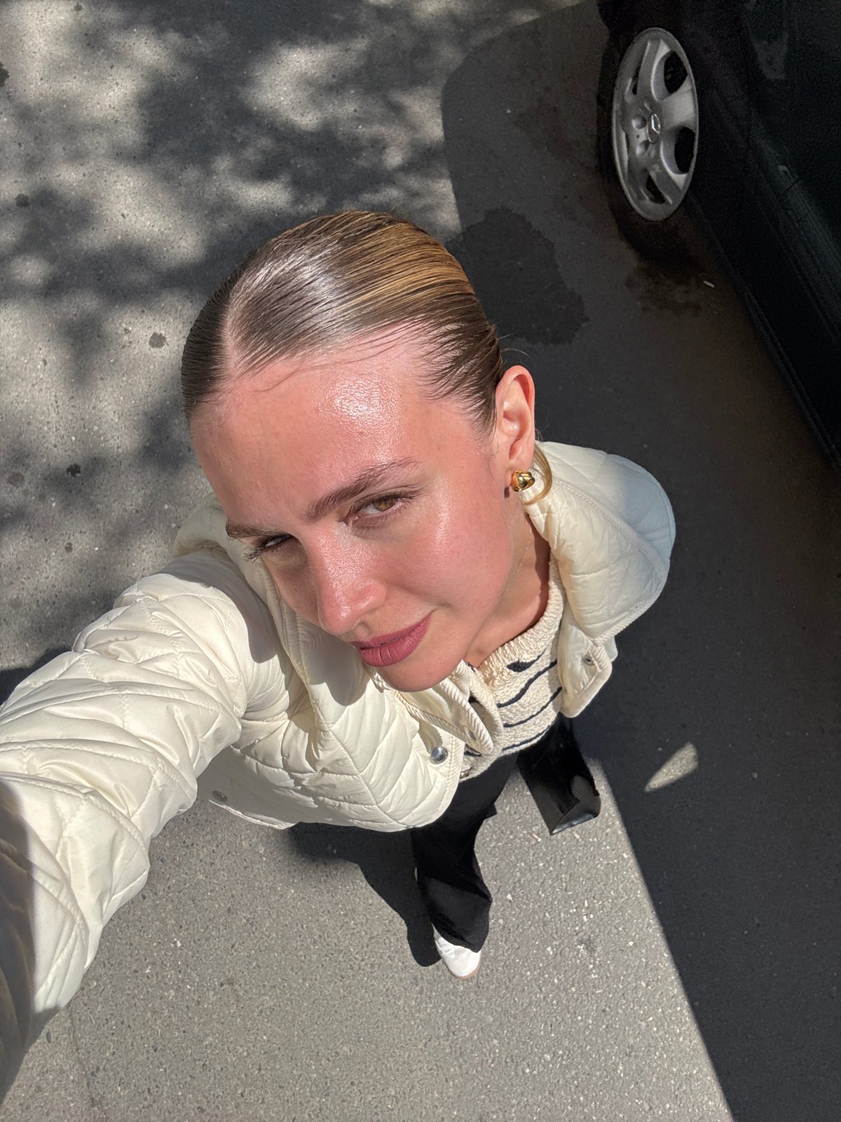 Morning moments captured in Tbilisi: woman, bird amid urban scene