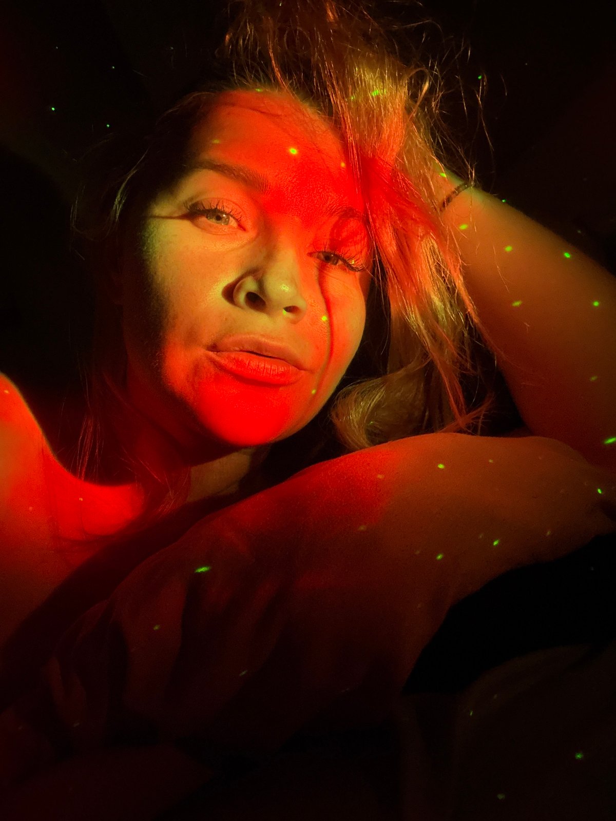 Woman photographed in colored light portrait session in Veliky Novgorod