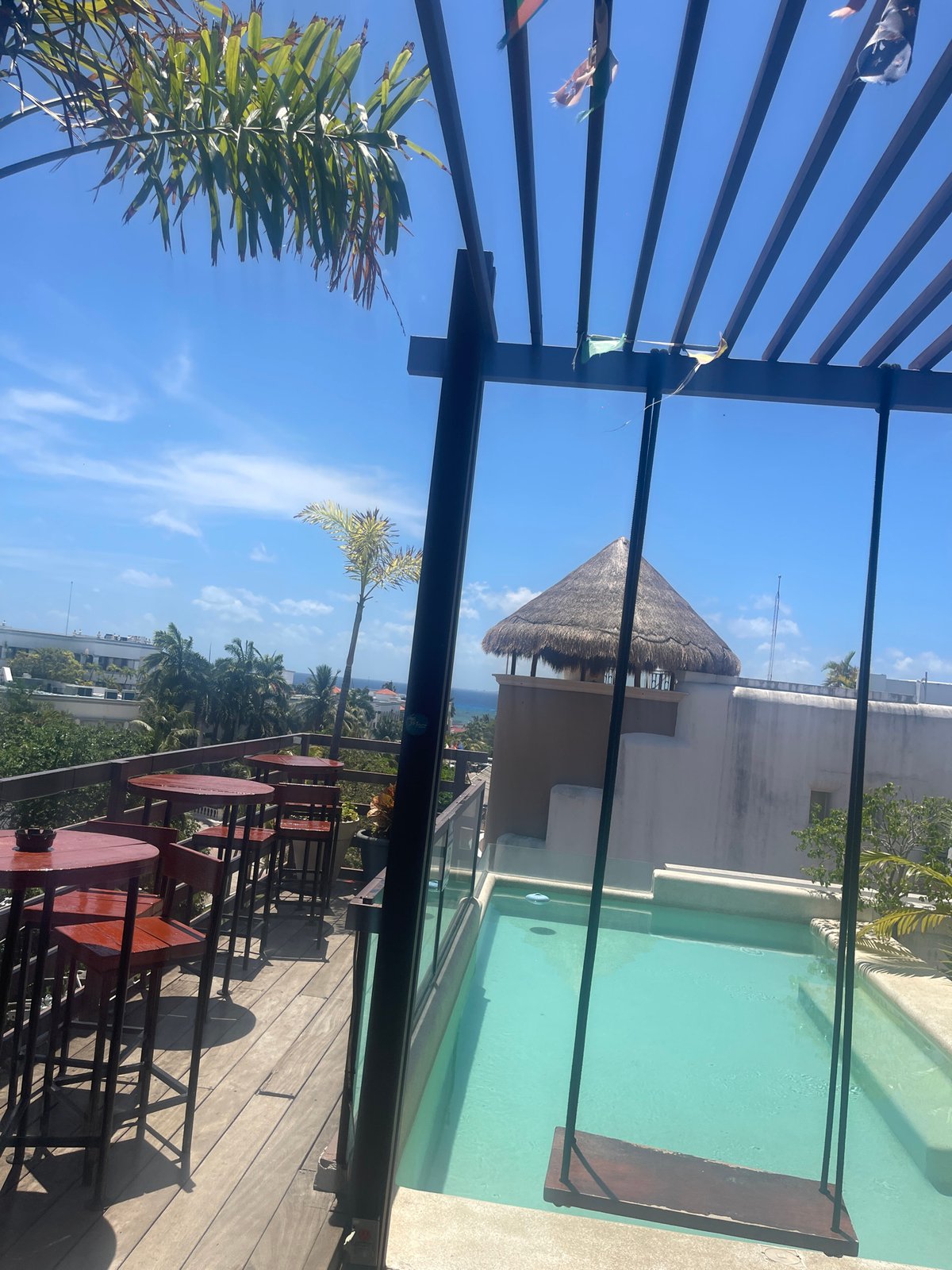 Rooftop pool area with decorative streamers captured in Playa del Carmen