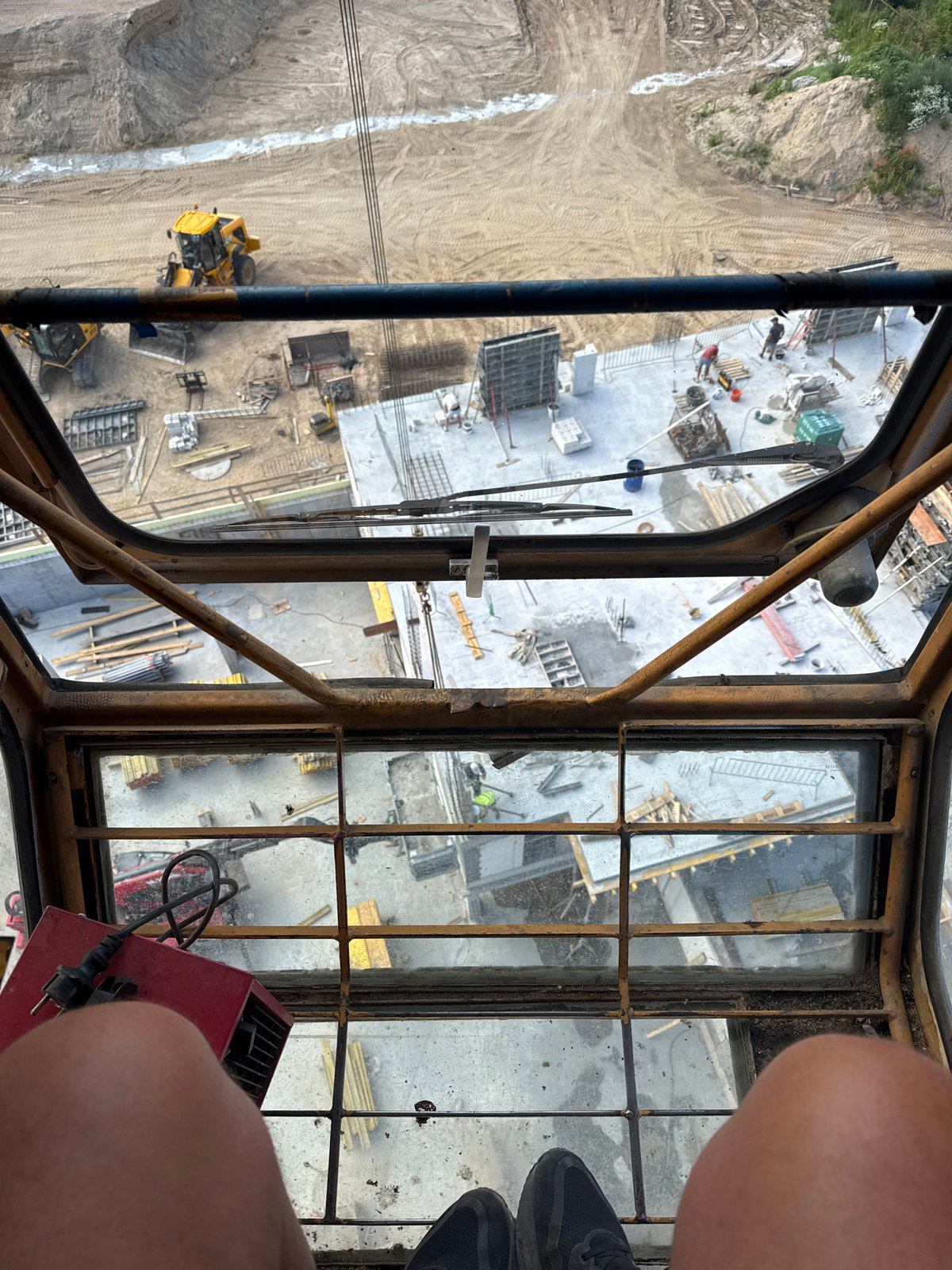 Crane-high views over a Mikołajki construction site and lake