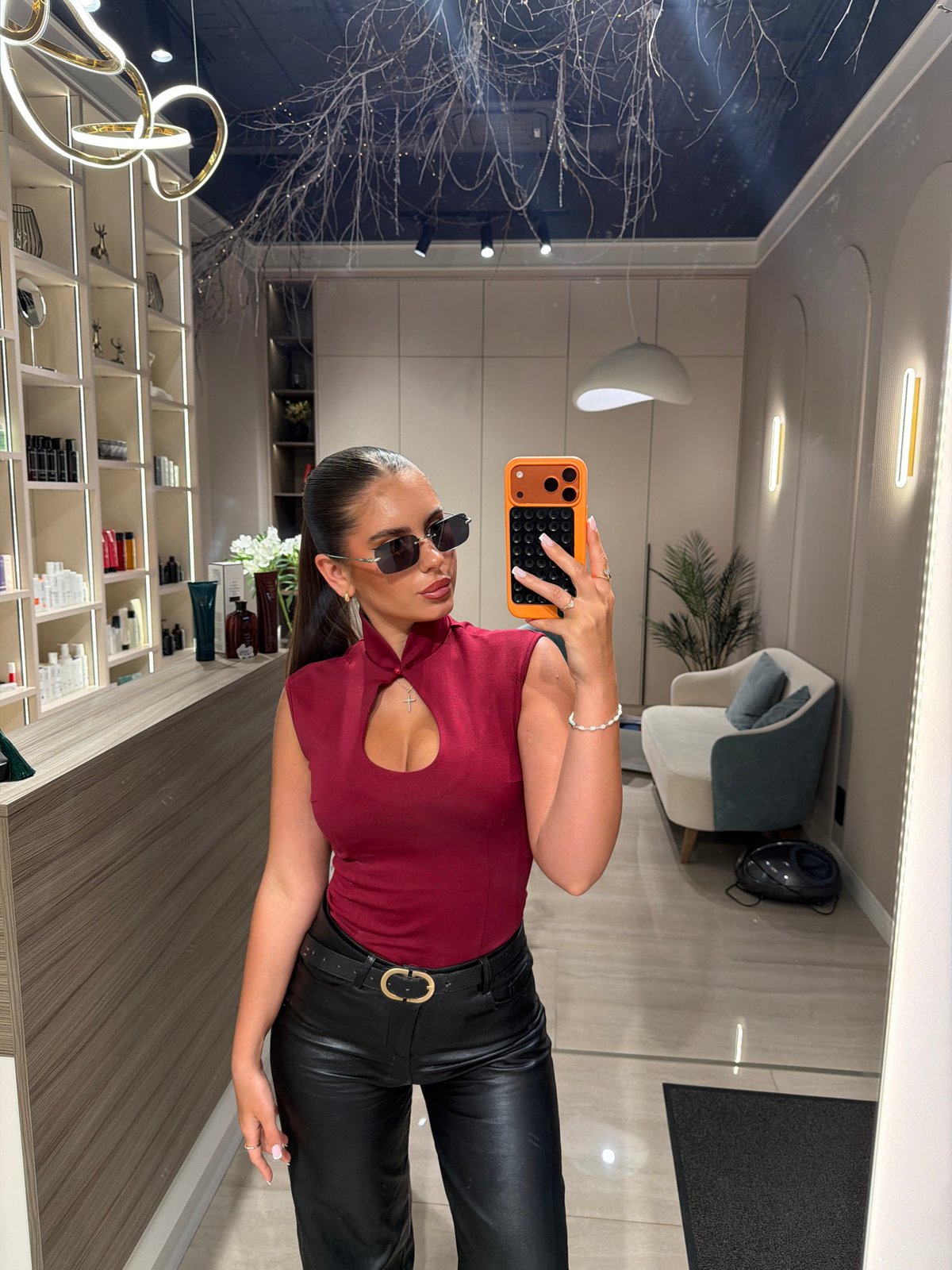 Woman takes mirror selfie in Krasnoyarsk salon