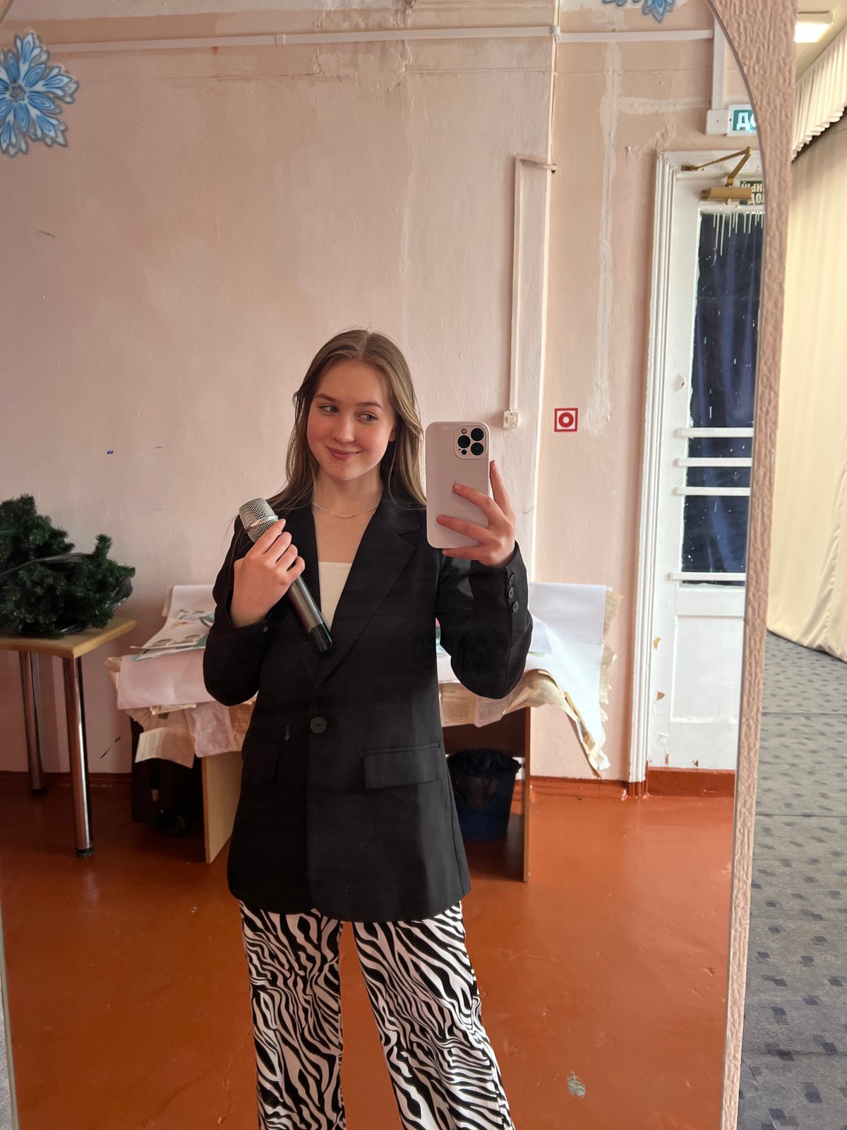 Woman takes selfie with microphone in Chaikovsky, Russia