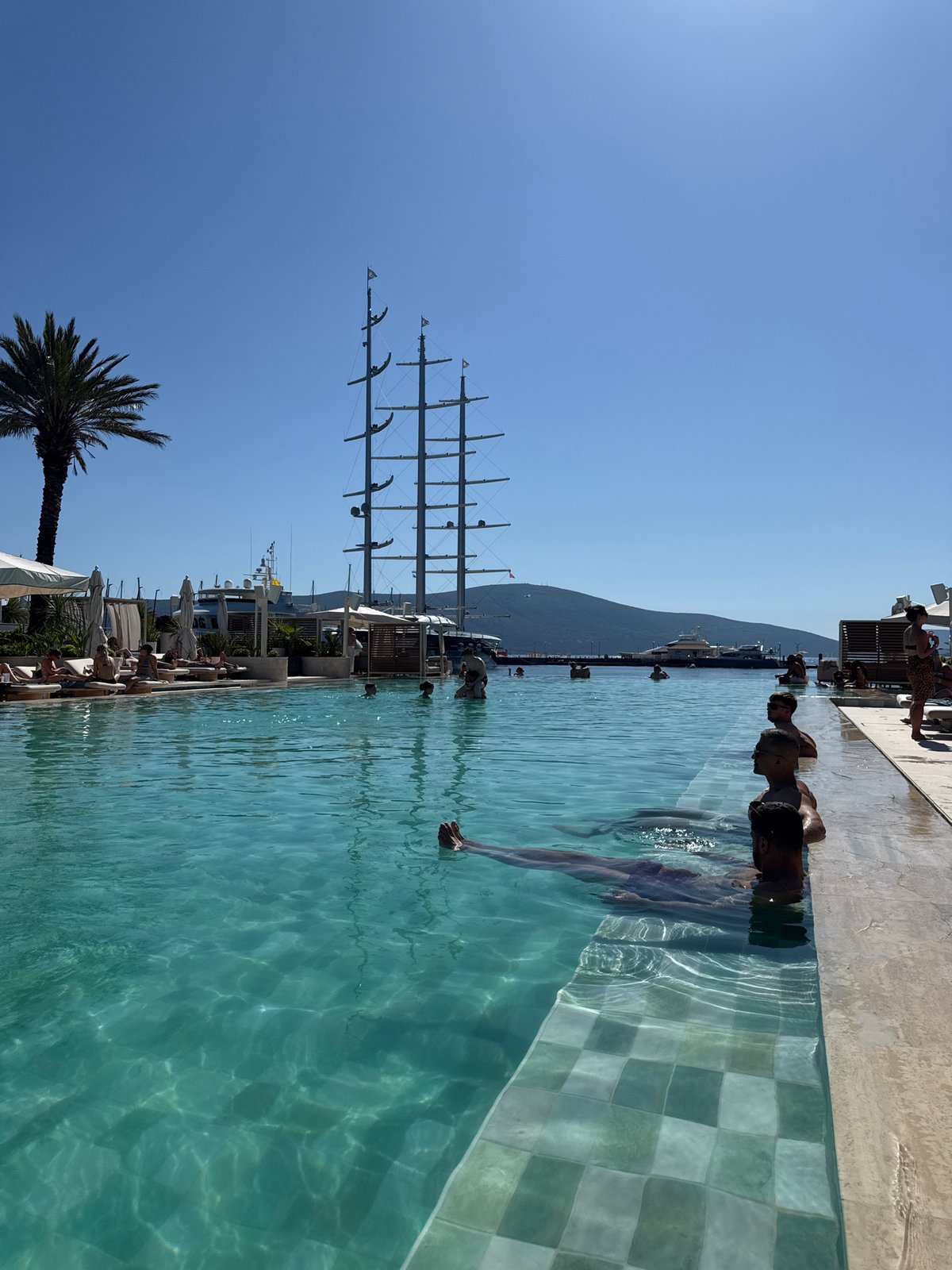 Swimmers enjoy sunny afternoon at Tivat infinity pool