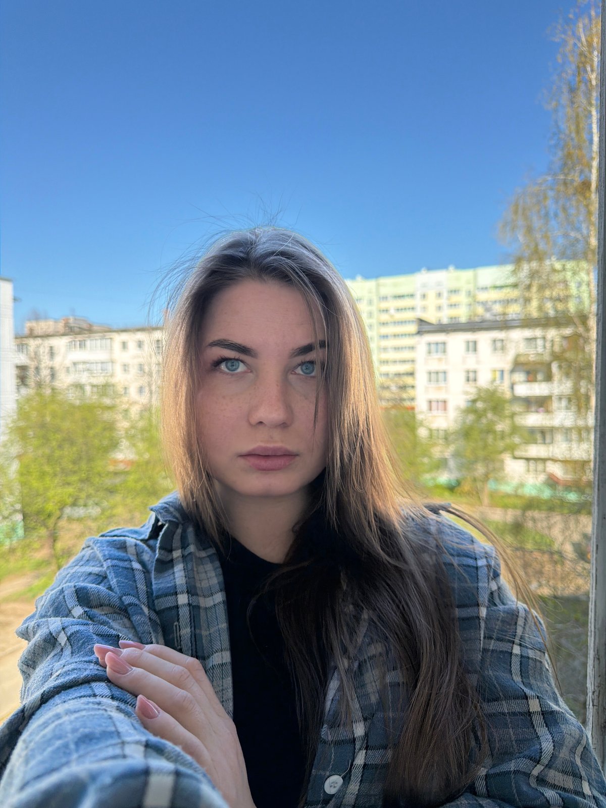 Woman takes early morning photos in Chaikovsky, Russia