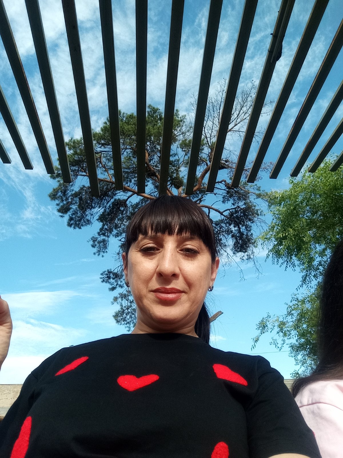 Relaxed park visit in Belogorsk with flowers, benches, and open skies