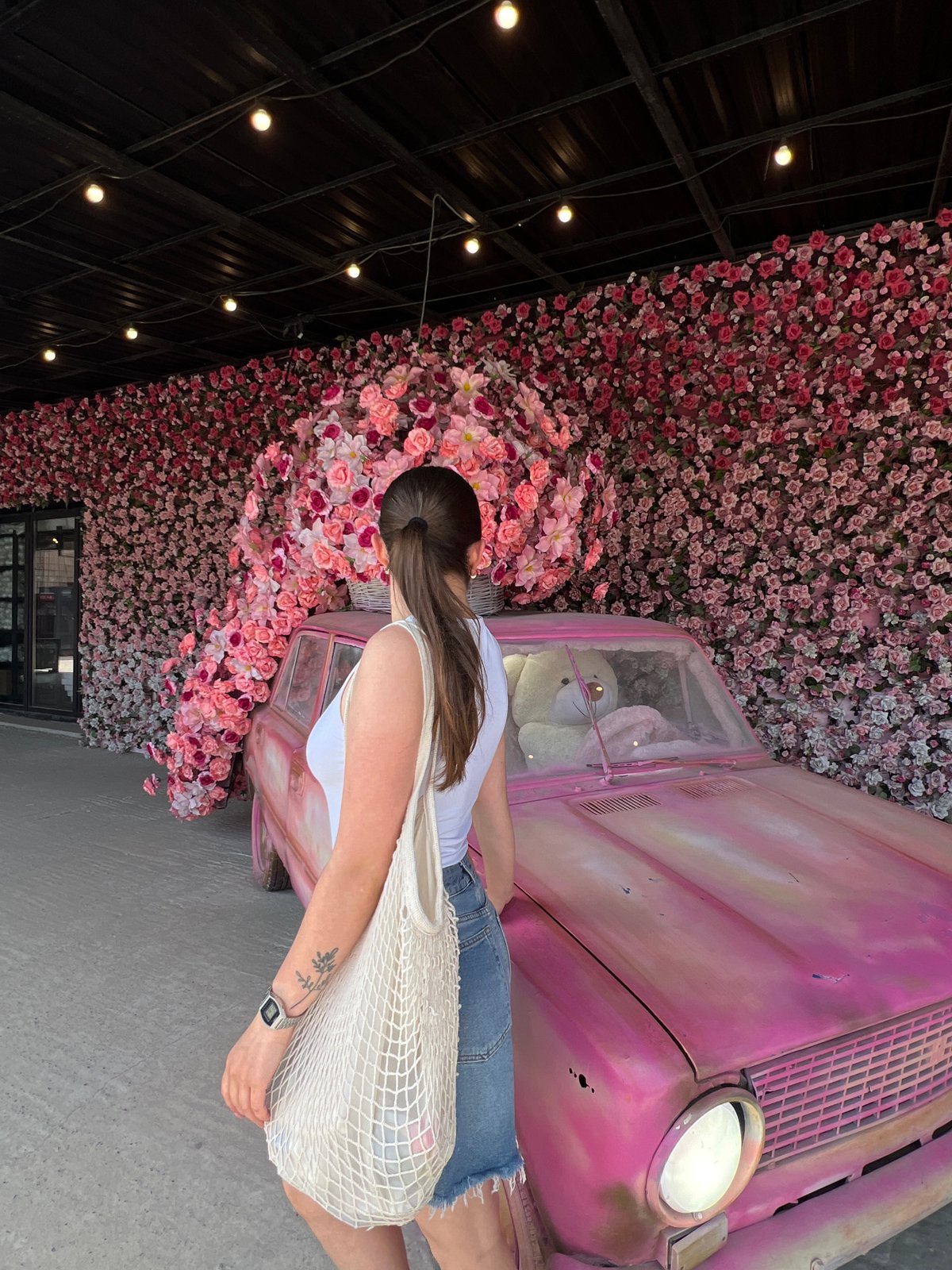 Floral-themed celebration with pink vintage car documented in Ternopil