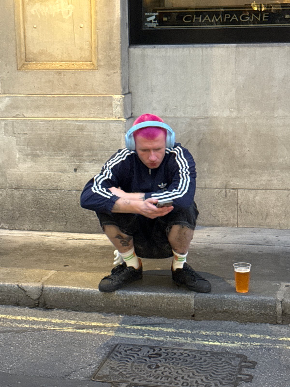 Street crowd gathers in London with Mullvad VPN screen on display