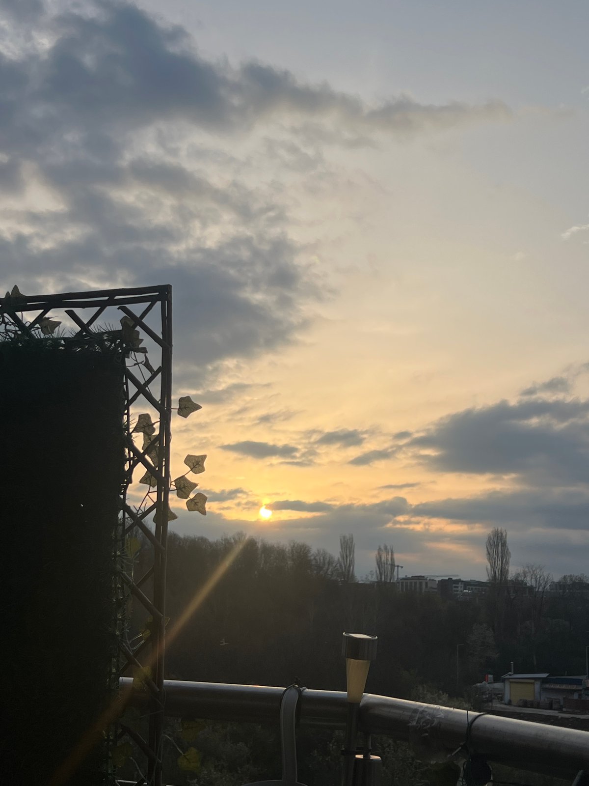 Evening sunset captured behind residential fence in Sofia, Bulgaria
