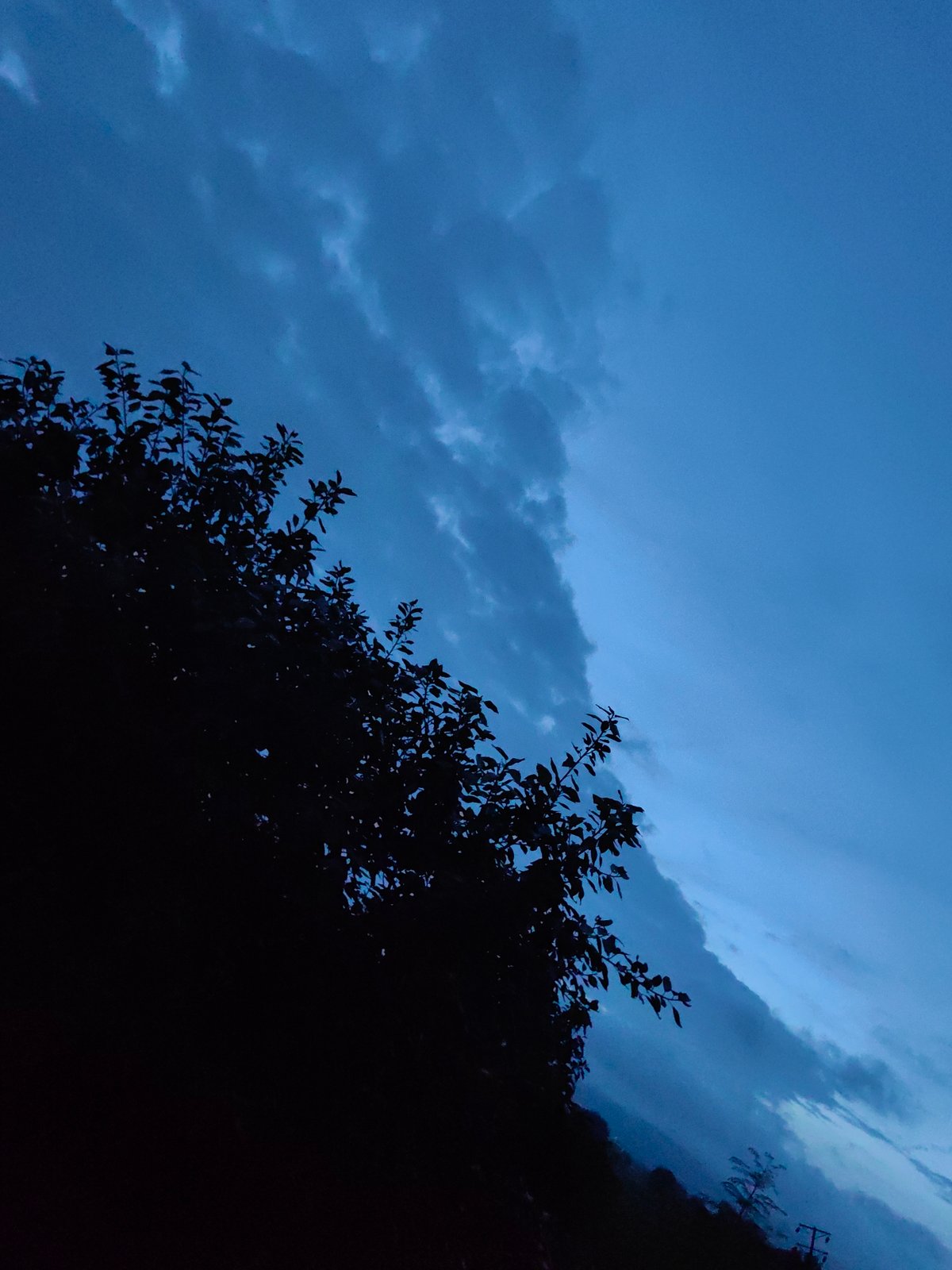 Dusk settles over Khuldabad's fields and historic surroundings