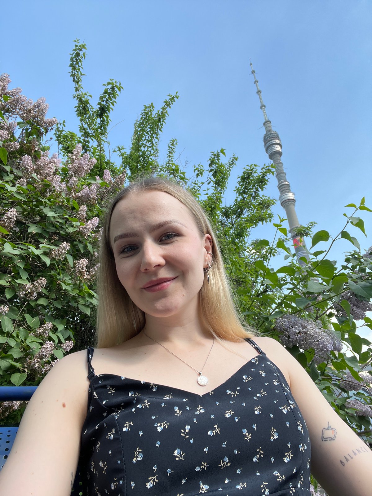 Woman takes spring selfies among lilac blooms in Khimki
