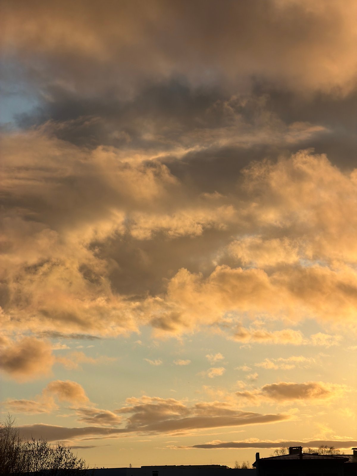 Sunset captured through clouds in Dreiliņi, Latvia