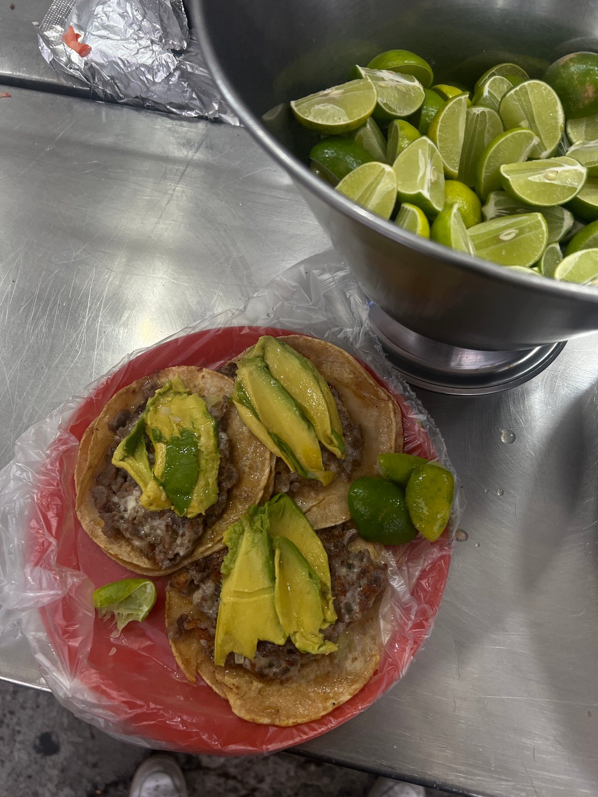 Late-night taco preparation documented at Mexico City food counter