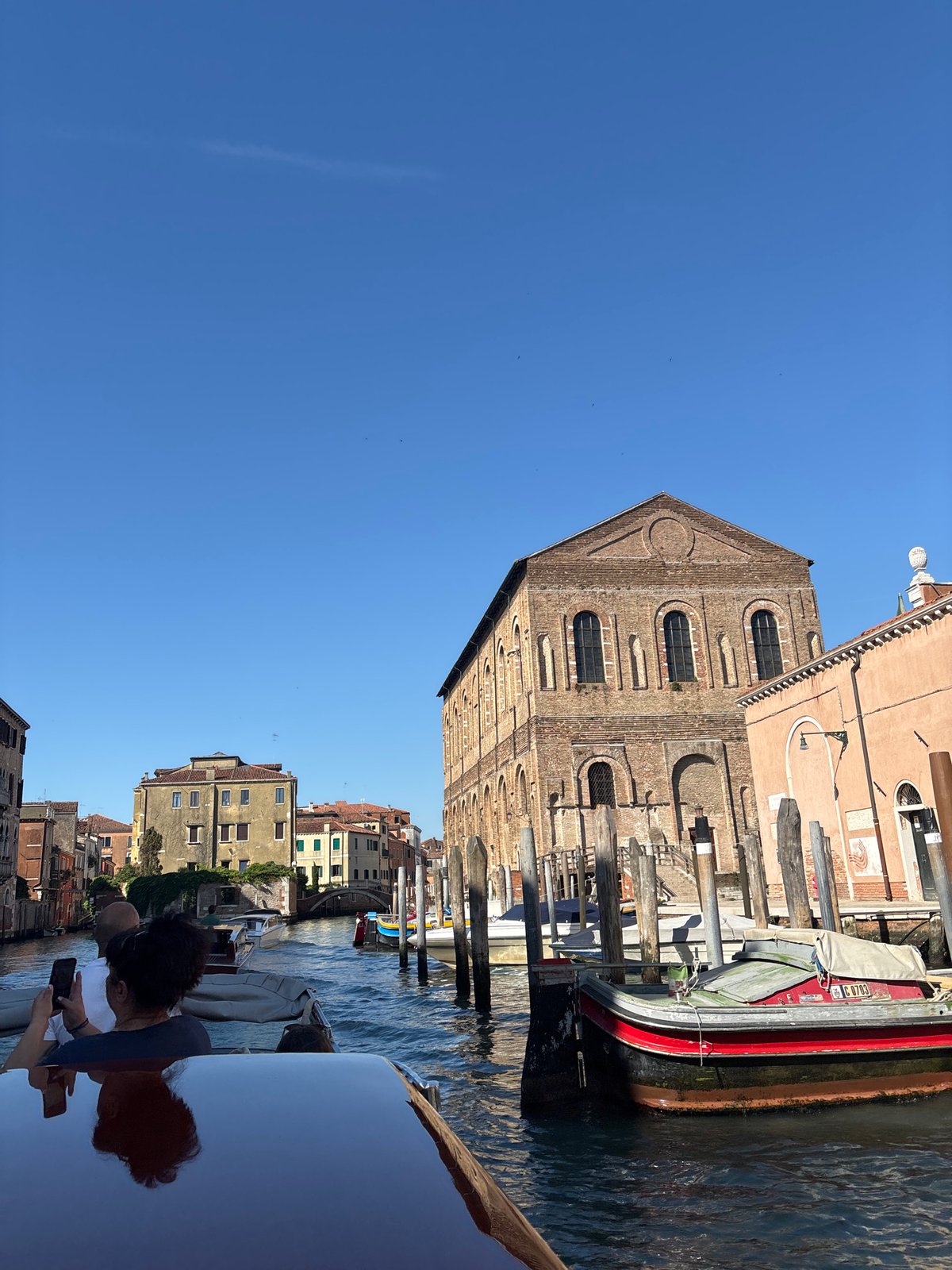 Venice canal scenes captured during sunny morning boat tour