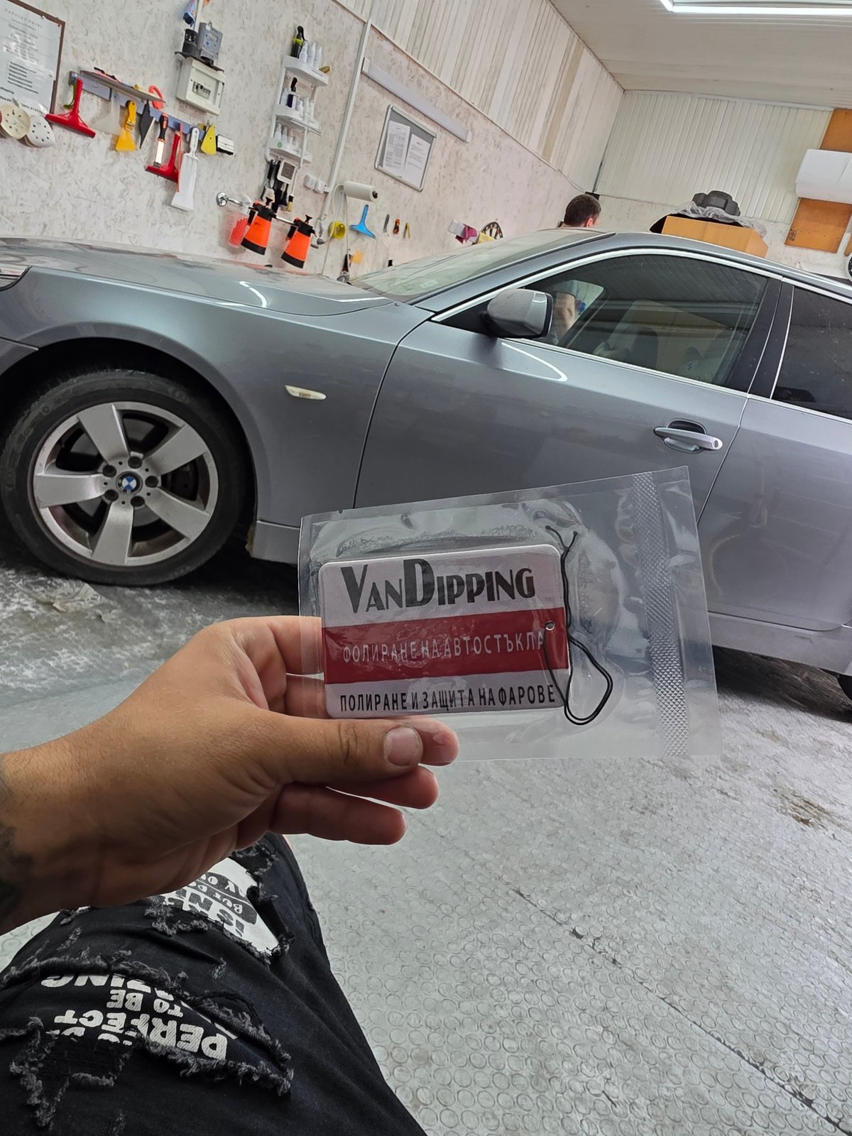 VanDIPPING branded black air freshener shown up close