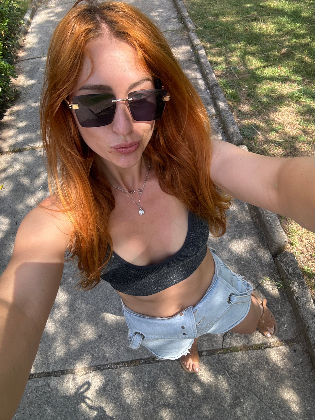 Woman takes selfies in Budva park during morning walk