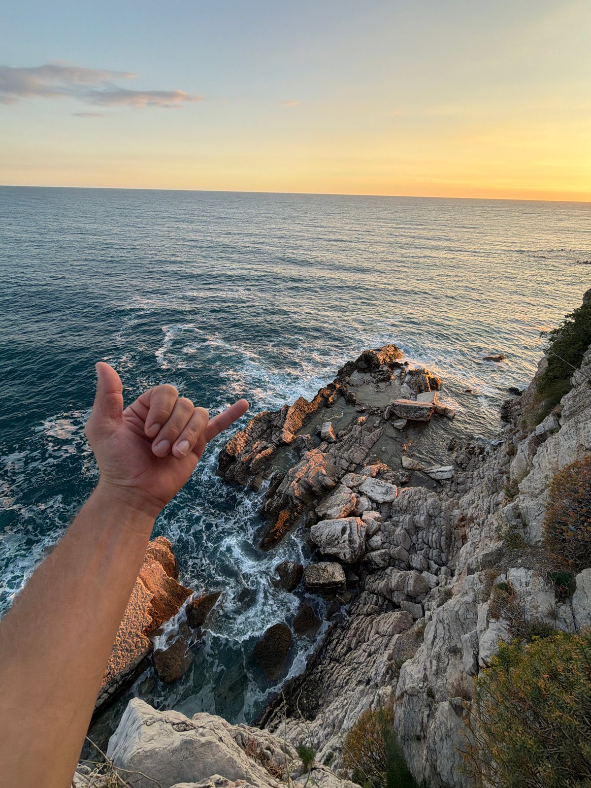 Dog walker enjoys coastal cliff walk in Montenegro
