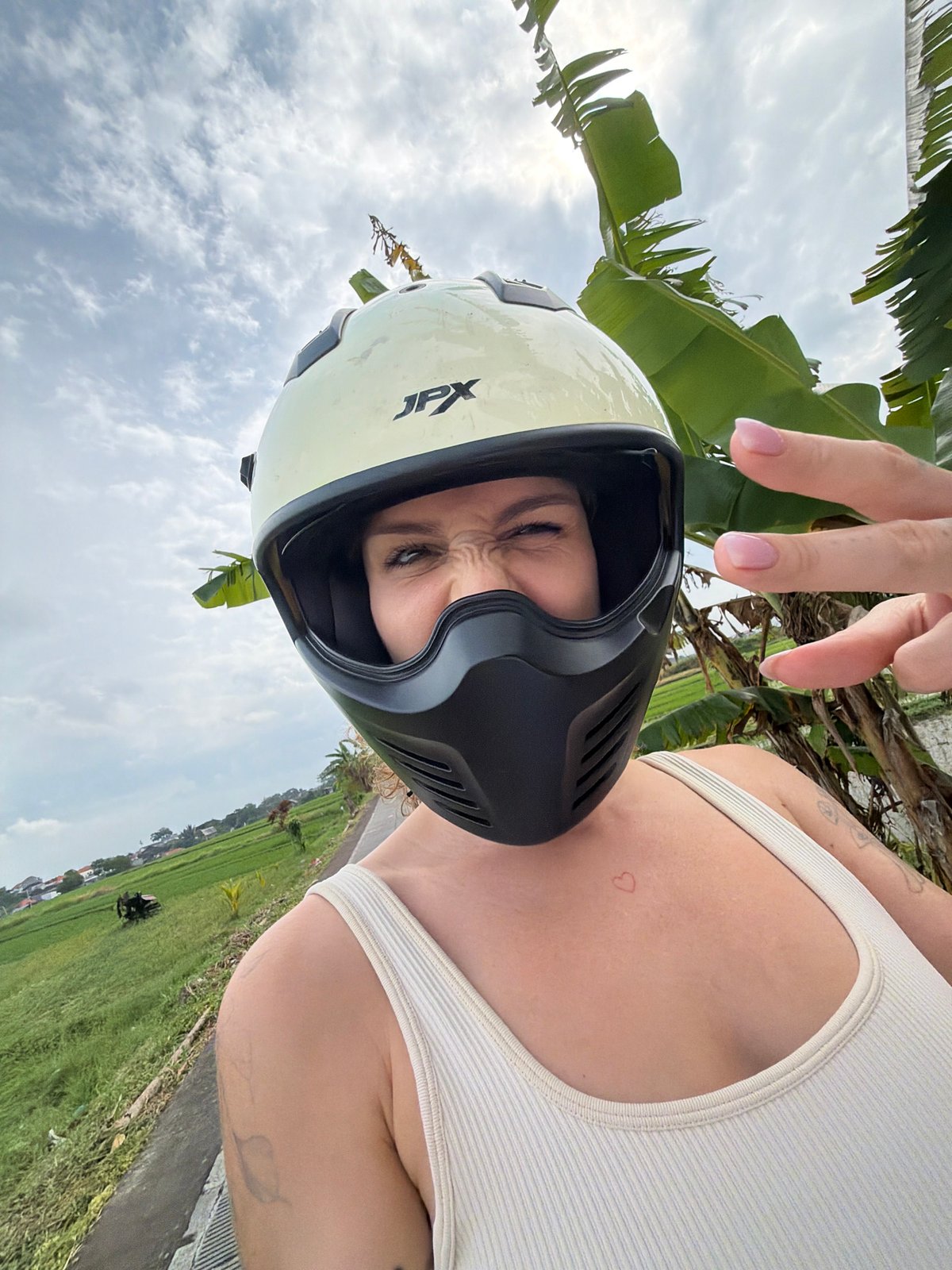 Late-night motorcycle ride captured through North Kuta rice paddies