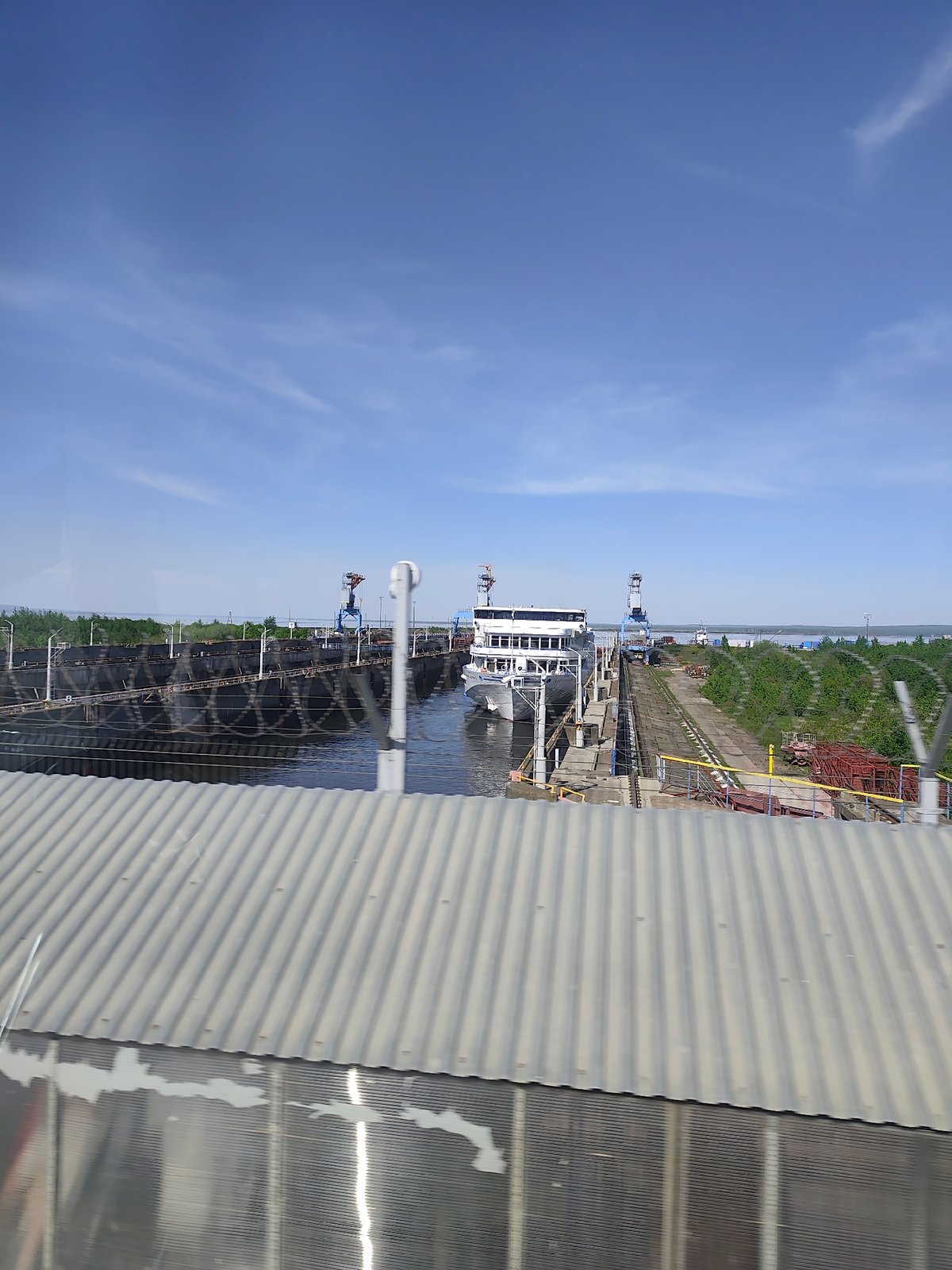 Spring day observations along Chaikovsky waterfront include ship transit