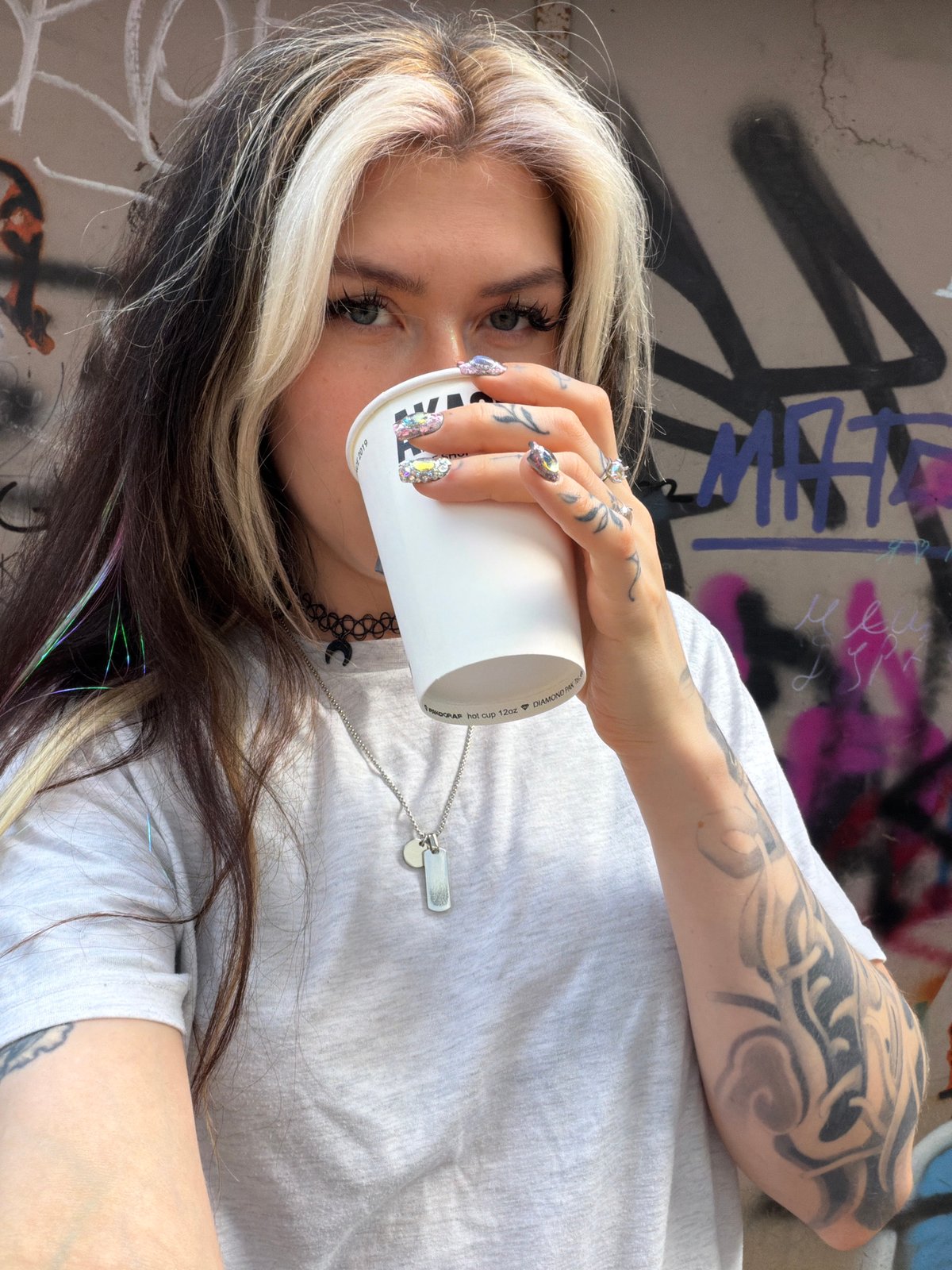 Portrait session documented against graffiti wall in Budva