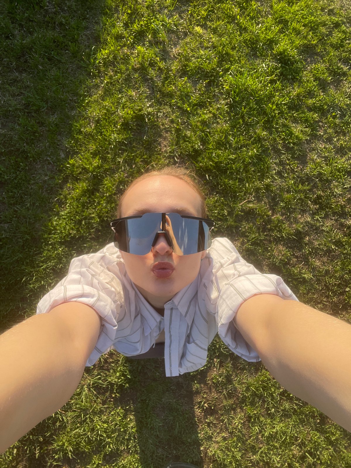 Person photographed with sunglasses on grass in Подшивалово, Russia