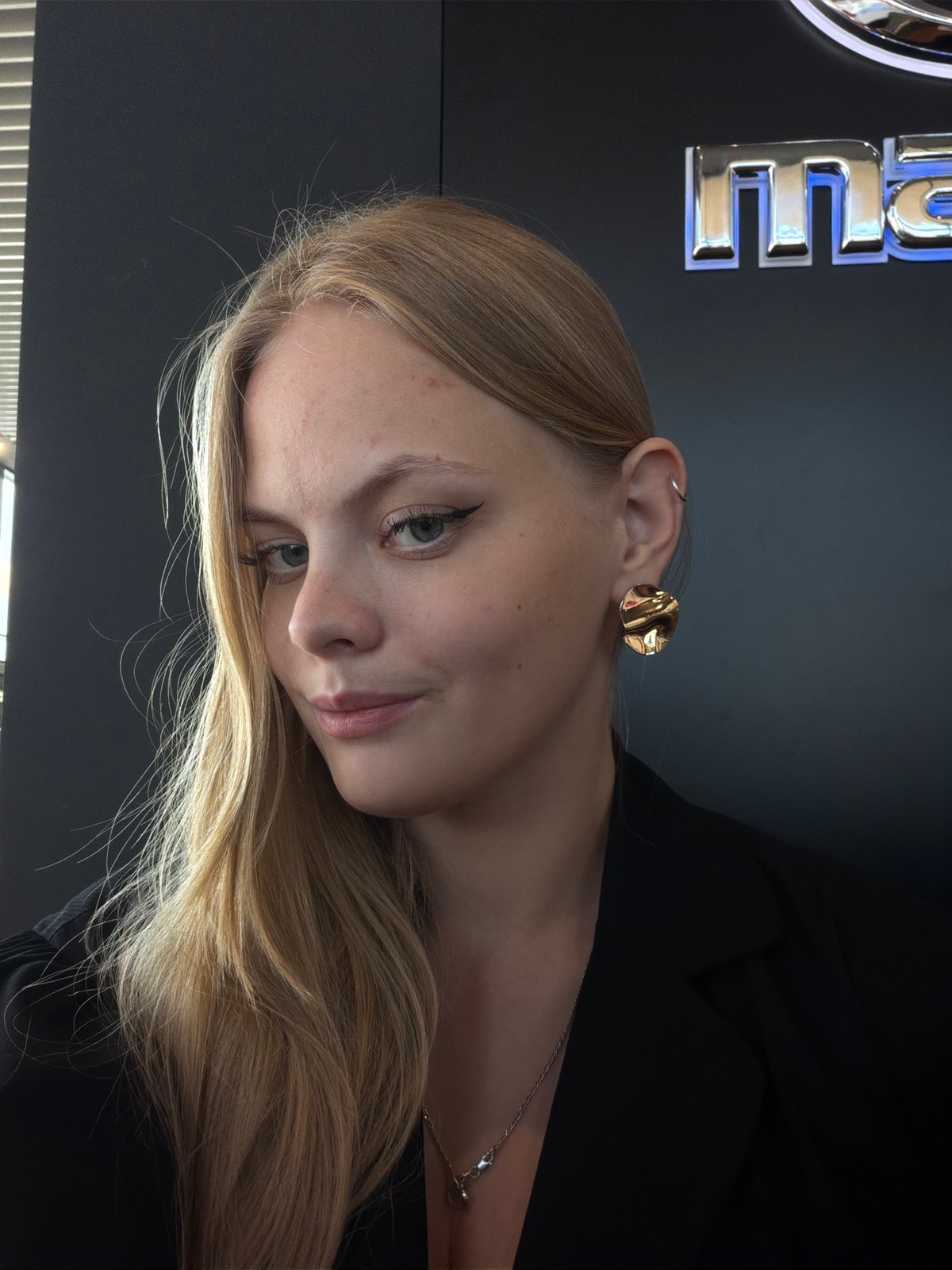 Woman documents personal moments indoors in Izhevsk, Russia