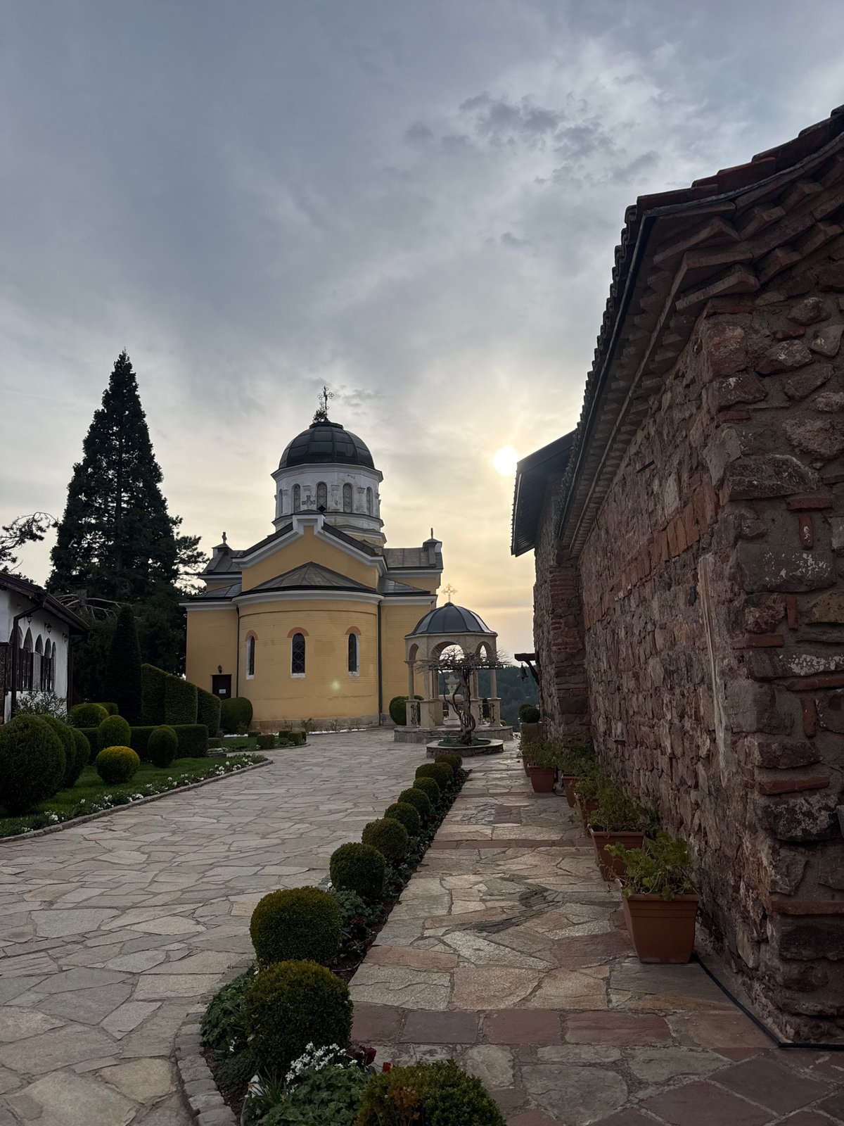 Tourist documents historic Sofia churches during afternoon visit