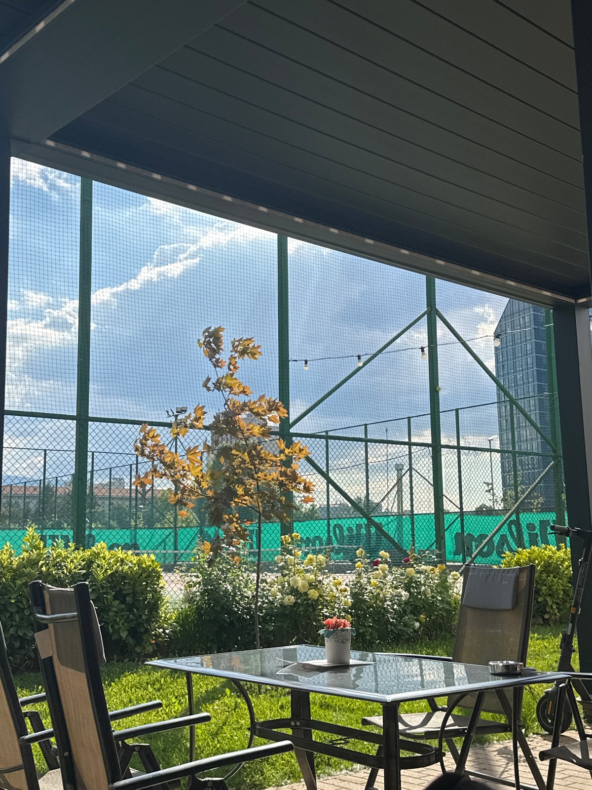 Tennis and cafe time captured in Sofia afternoon