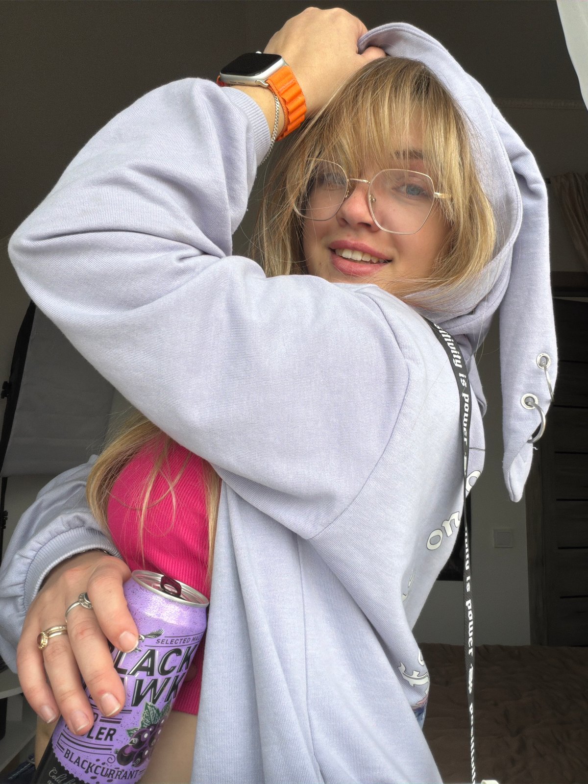 Person takes selfie with decorated phone in Russian village