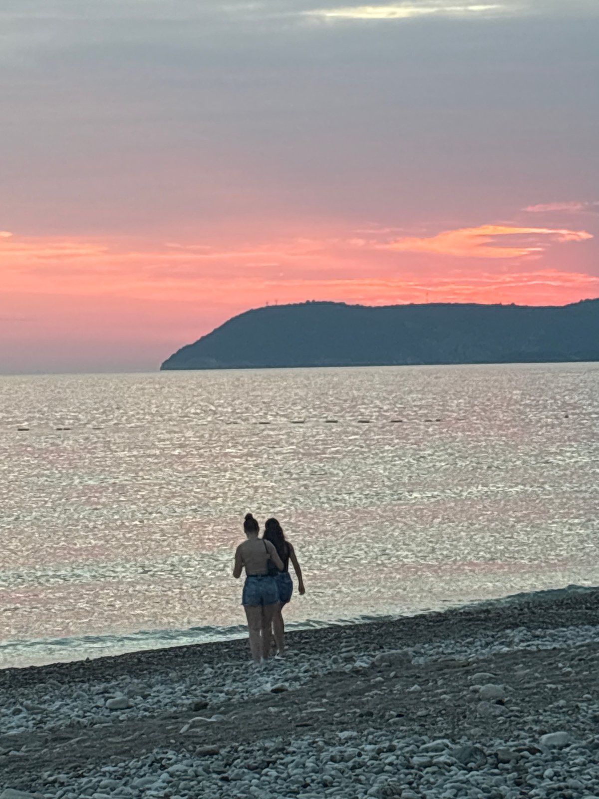 Sunset evening on the pebbled shores of Bar, Montenegro