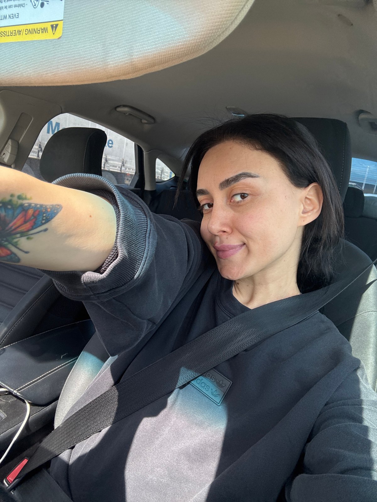 Woman takes car selfie in Tbilisi