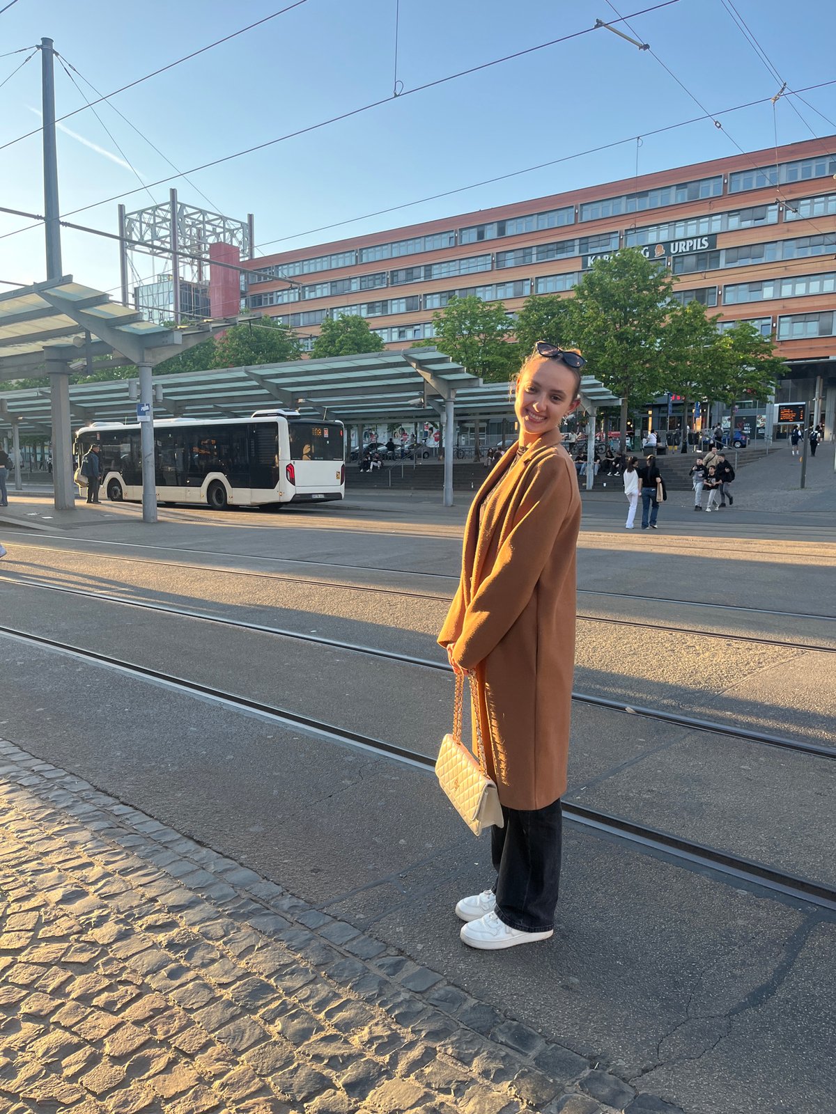 Woman photographed near Saarbrücken train station in evening light