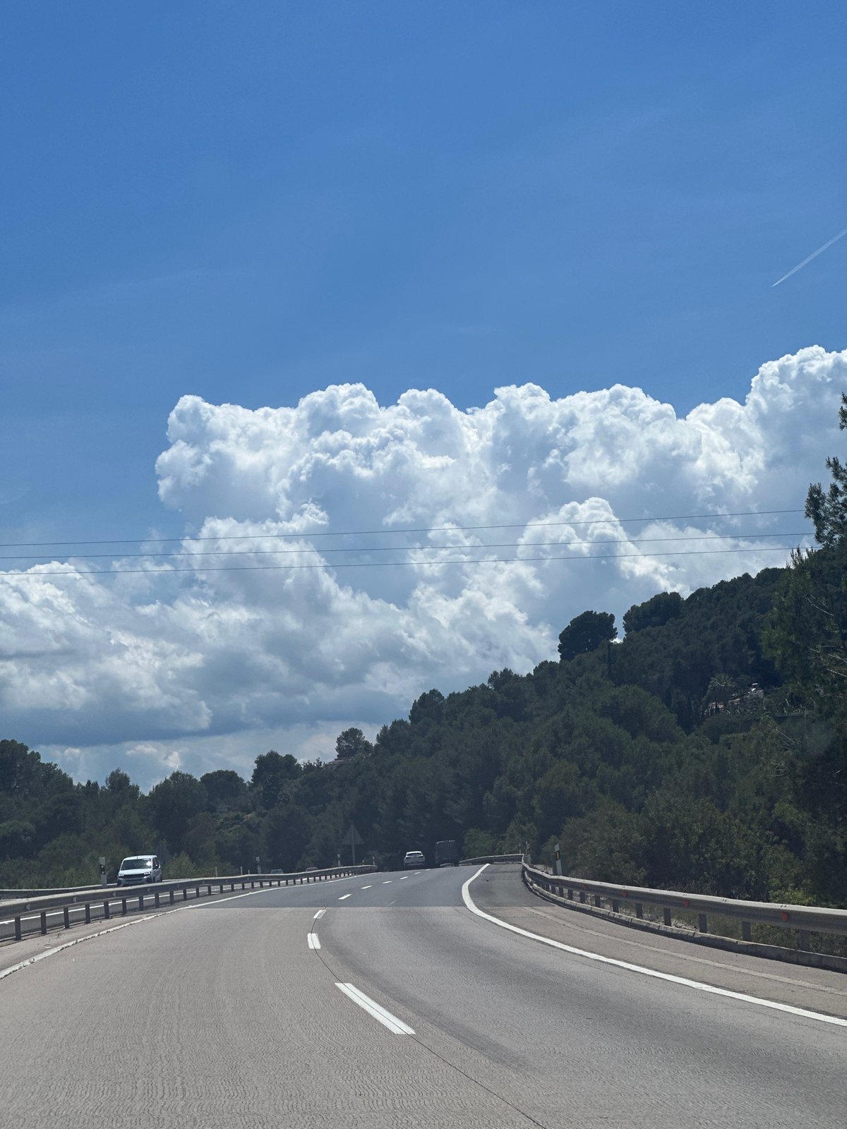 Highway scene documented under blue skies near la Font d'en Carròs