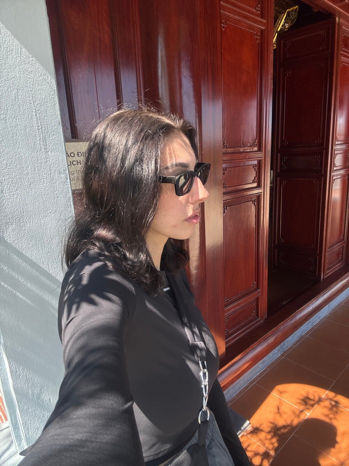 Woman documents morning visit to Vietnamese Buddhist temple complex