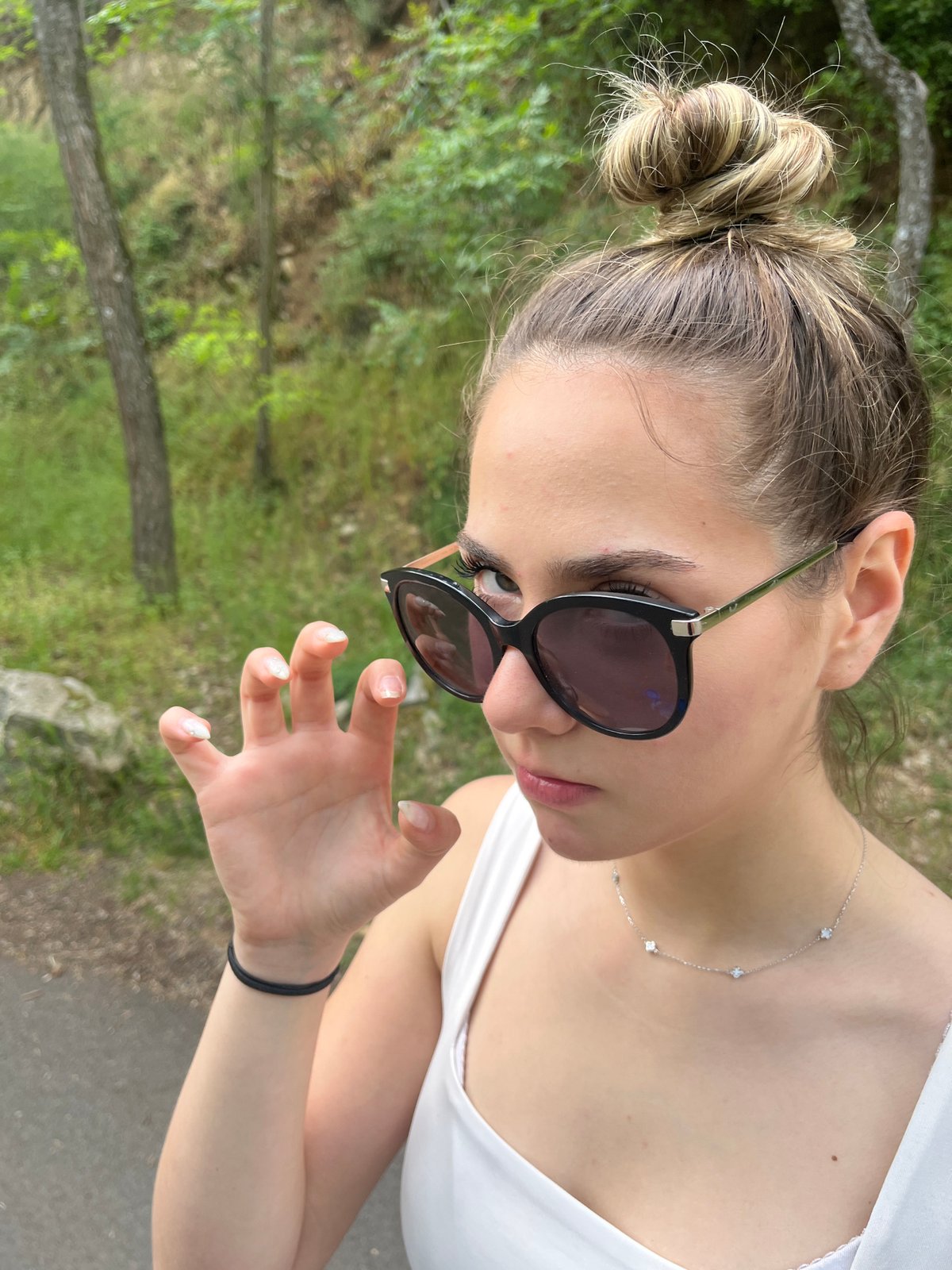 Woman in sunglasses observed outdoors in Blagoevgrad, Bulgaria
