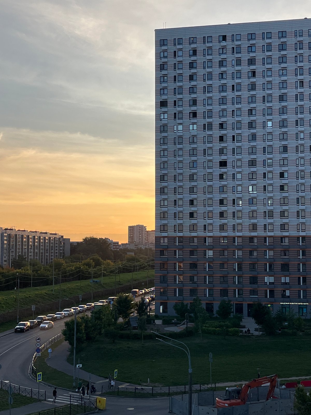 Sunset across Moscow and Lyubertsy, with robots on the sidewalk