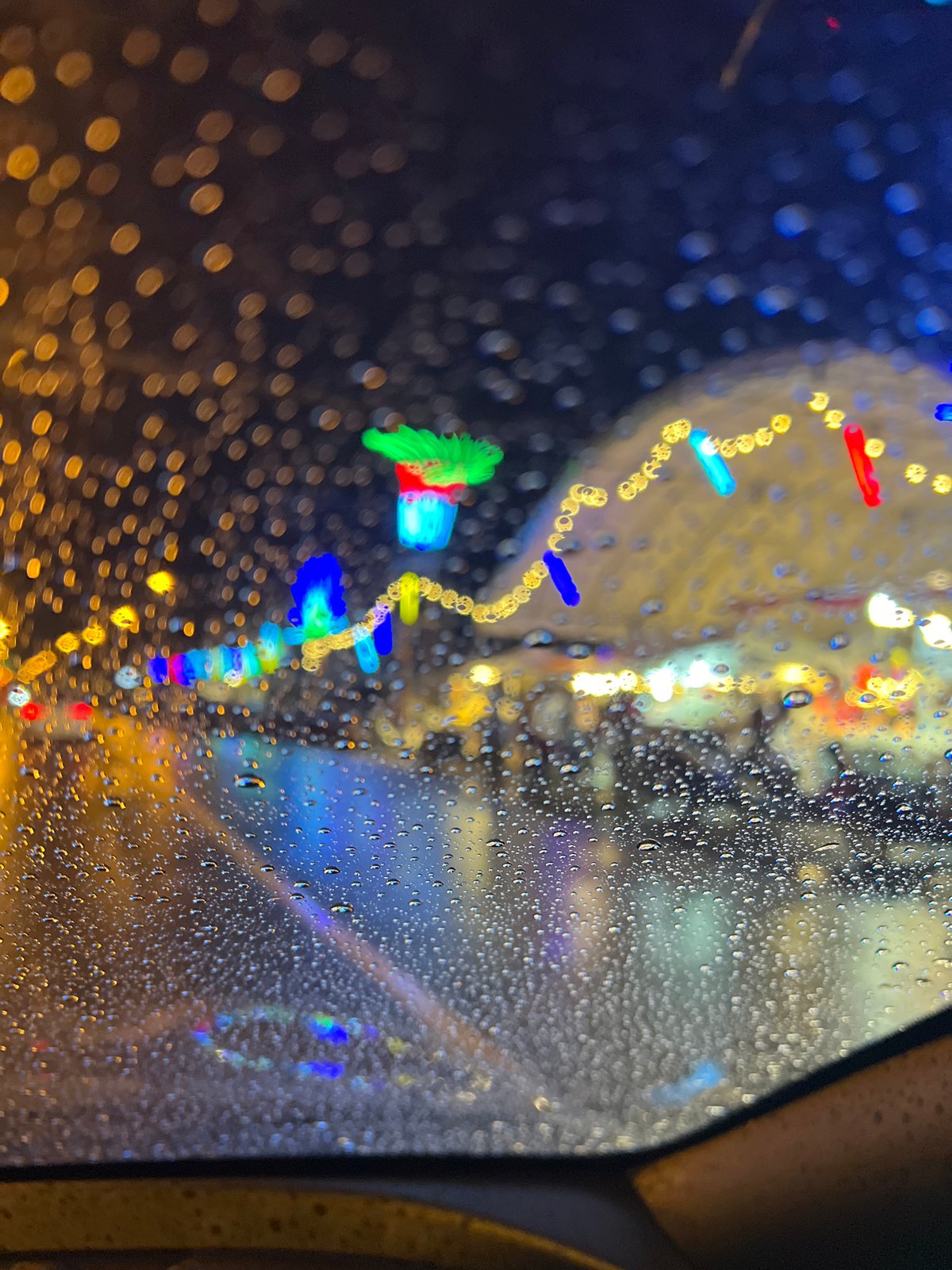 Rain-streaked window view captured in Baan Bo Phut, Thailand