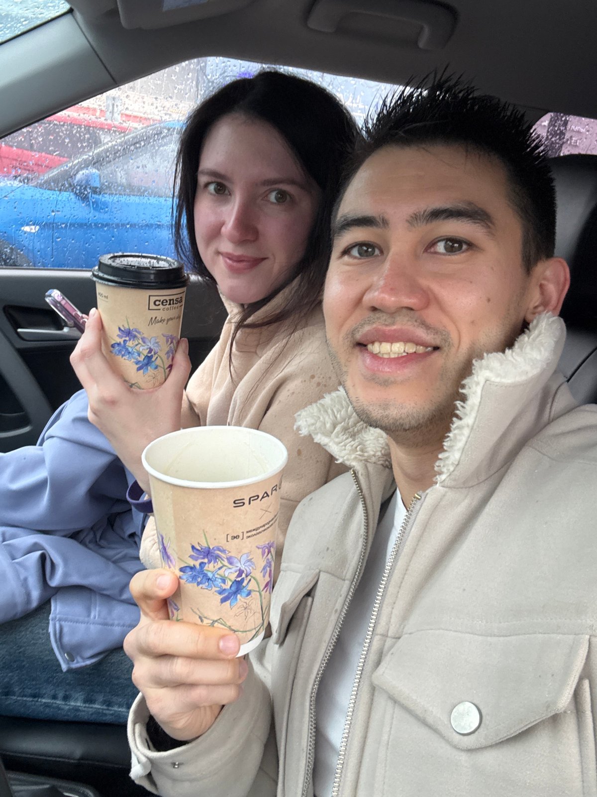 Coffee break shared in car during Kazan rainstorm