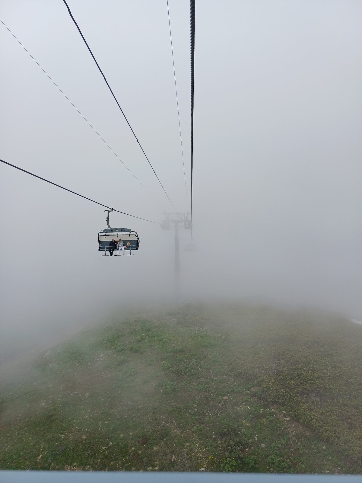 Foggy summer morning at a ski lift in Estosadok, Russia