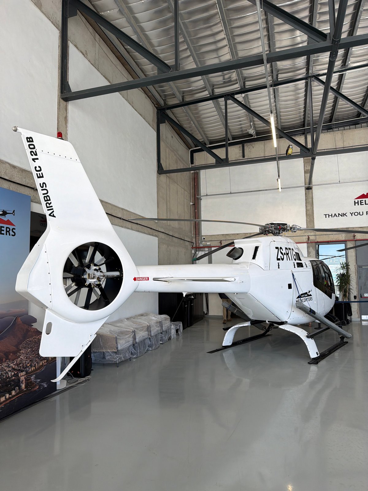 White helicopter spotted at Cape Town facility during maintenance operations