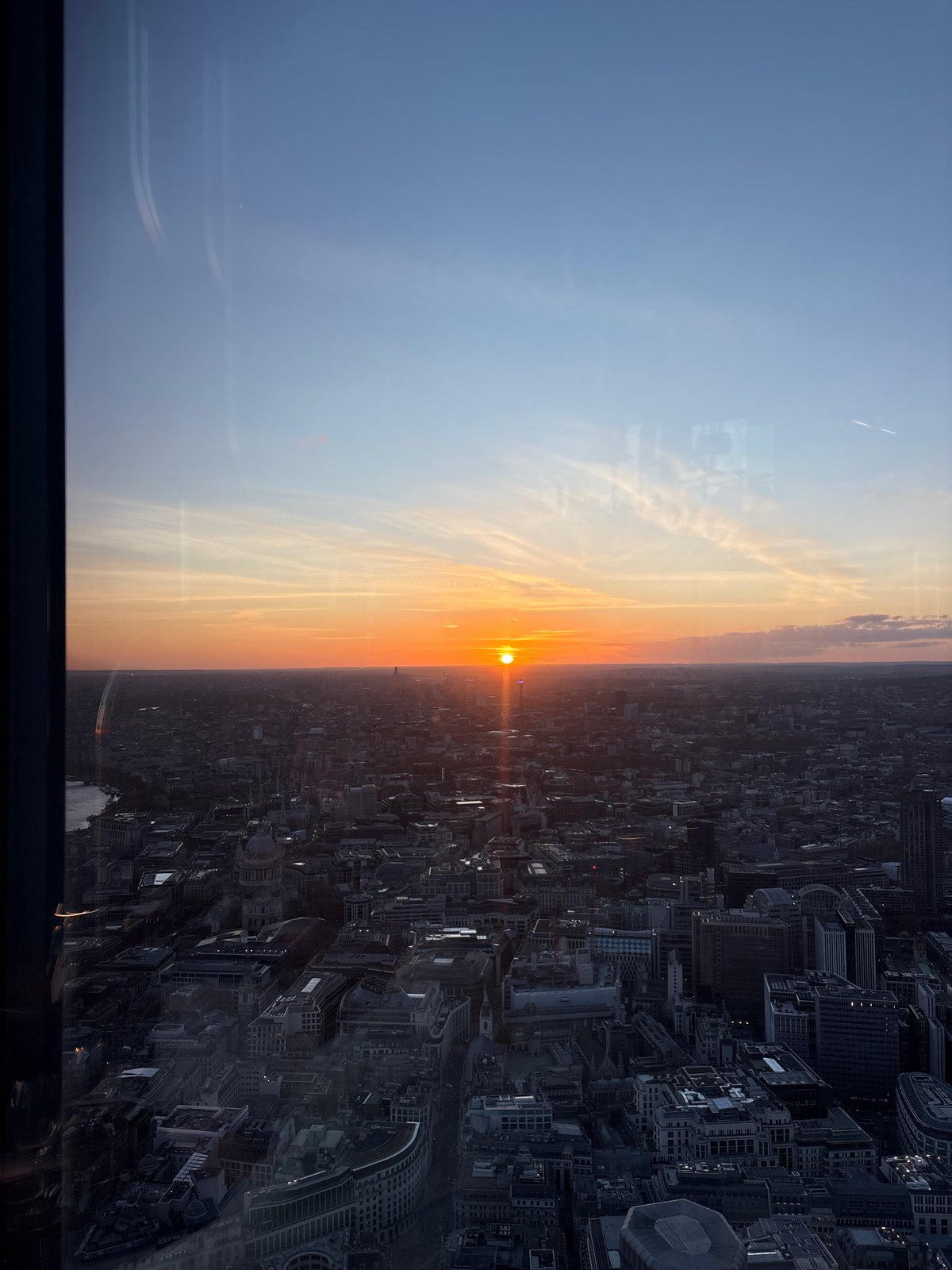 London rooftop venue captures sunset cityscape during evening hours