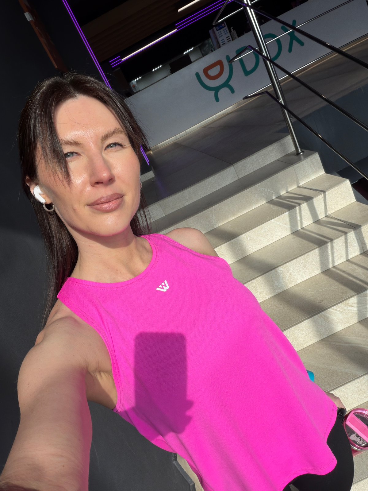 Woman takes selfie in pink top in Perm, Russia