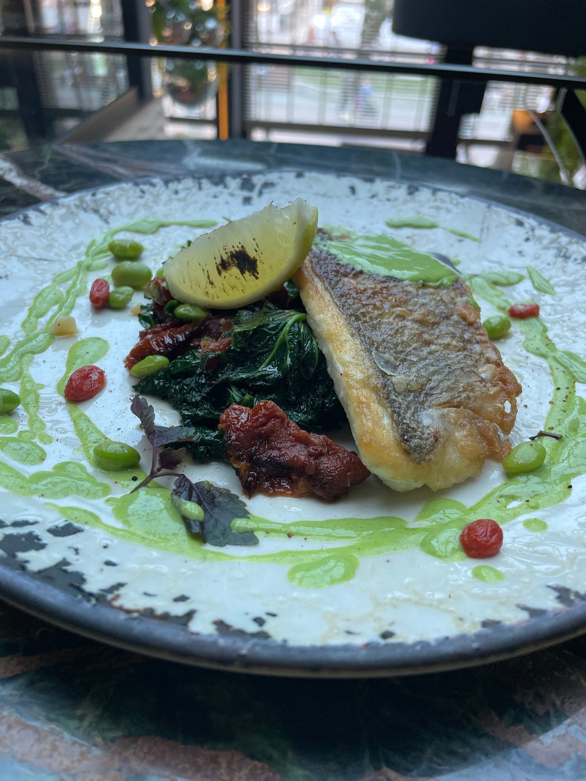 Fish dish with greens documented at unknown location