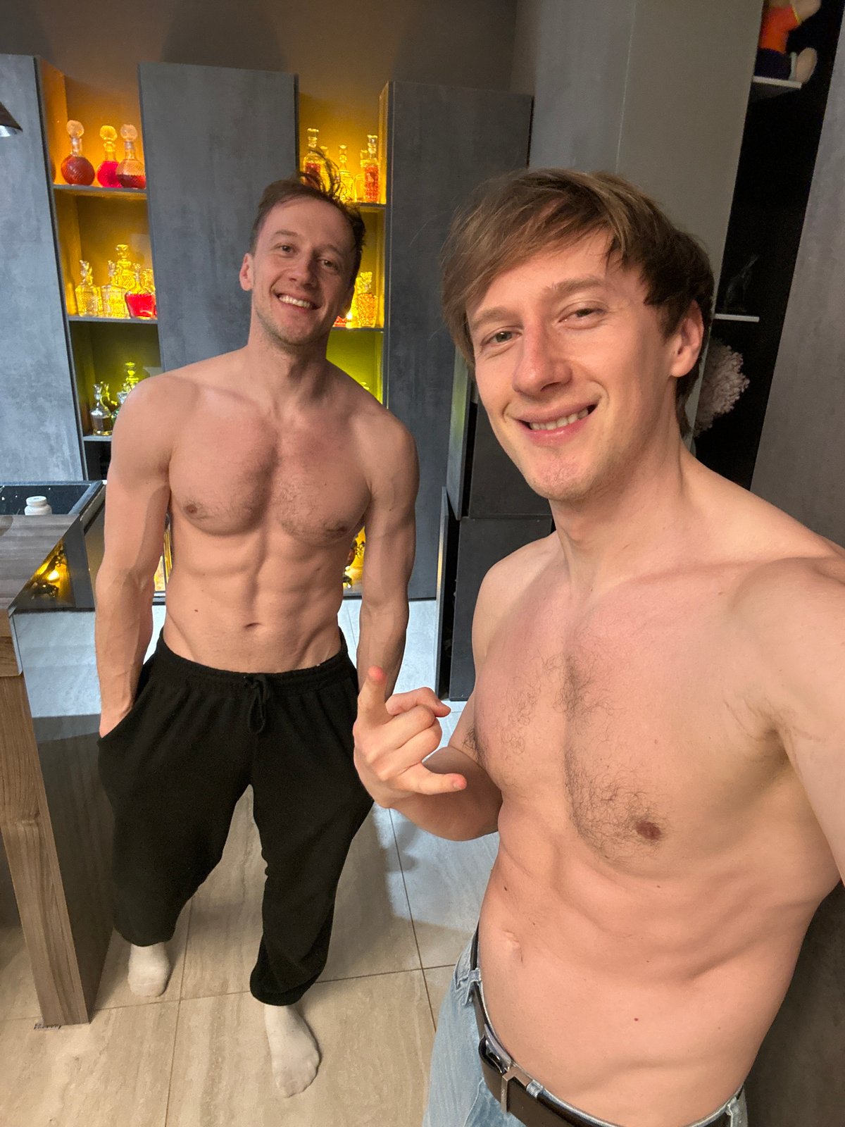 Two men photographed with bottles in Kursk home