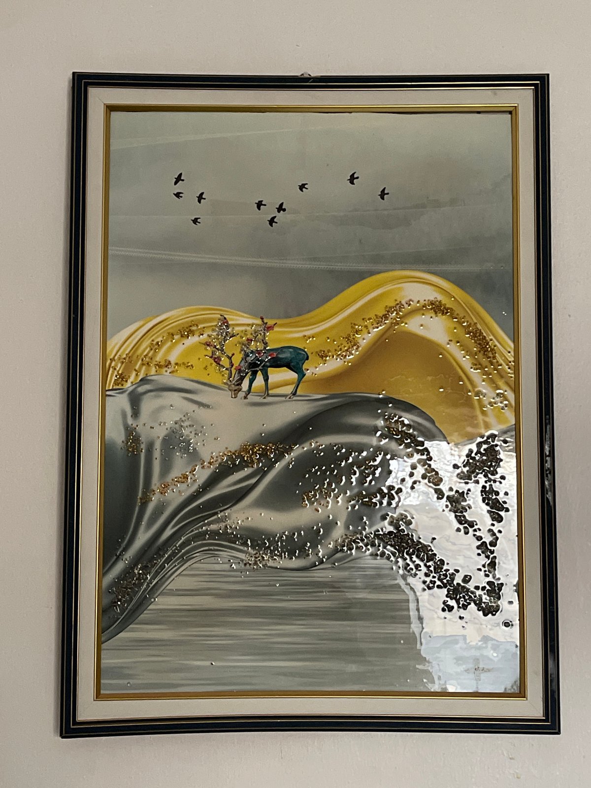 Abstract gold-silver artwork observed on wall in Kuchingoro