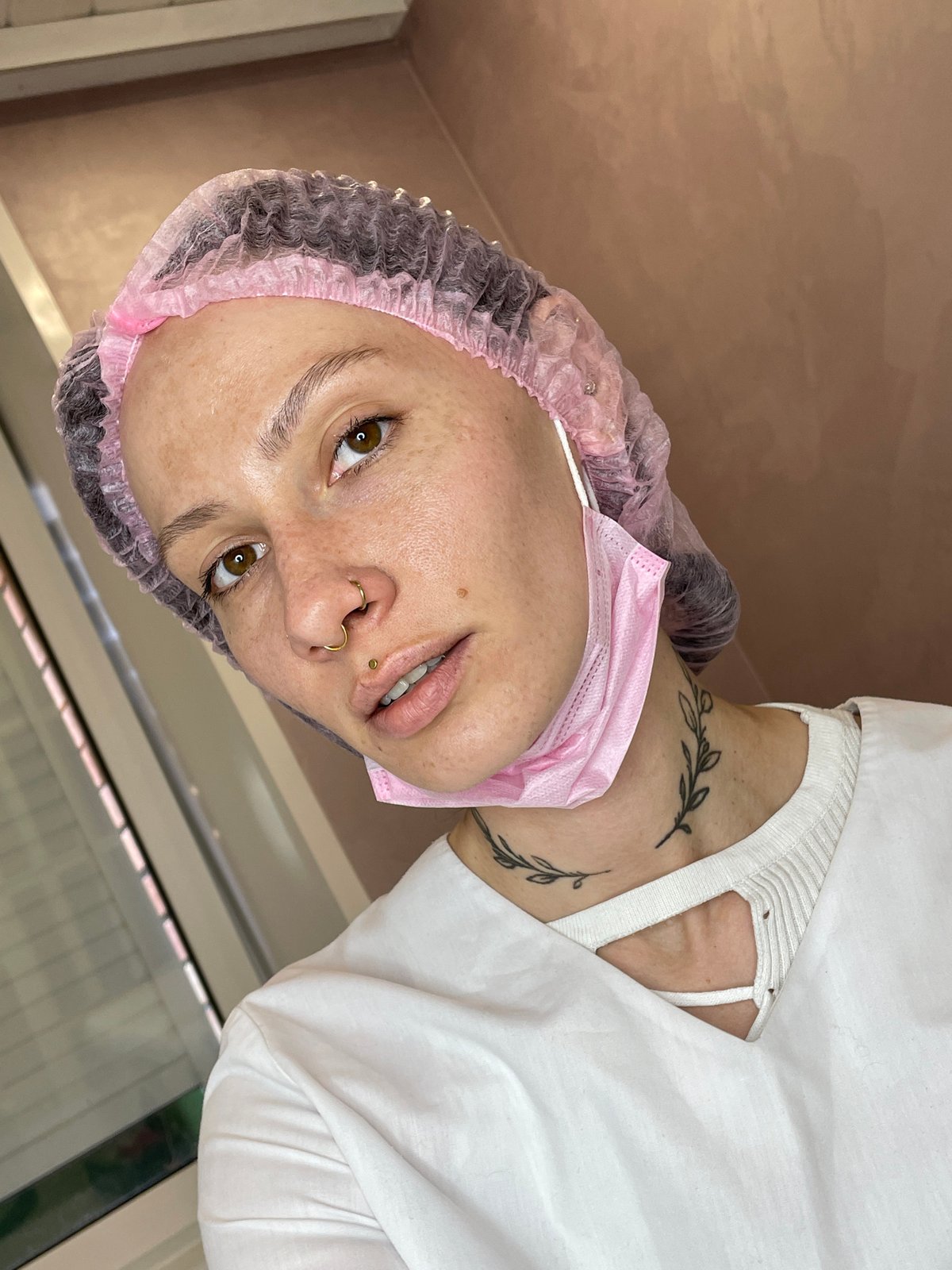 Woman in surgical attire observed in Izhevsk medical setting