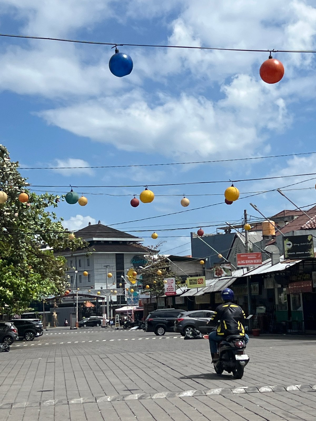 Kuta street traffic on a sunny Bali afternoon