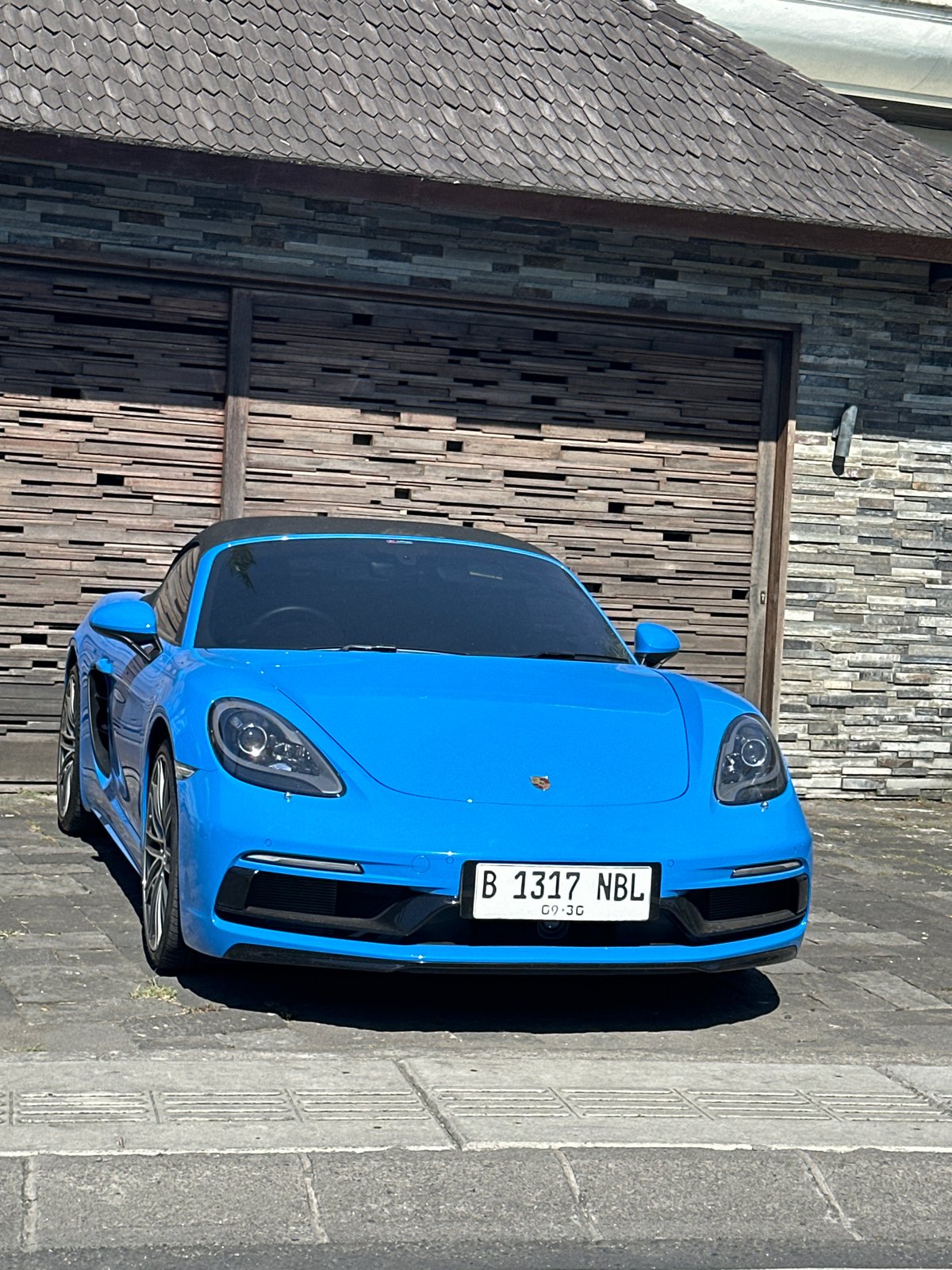 Blue Porsche, rice paddies, and a scooter in North Kuta