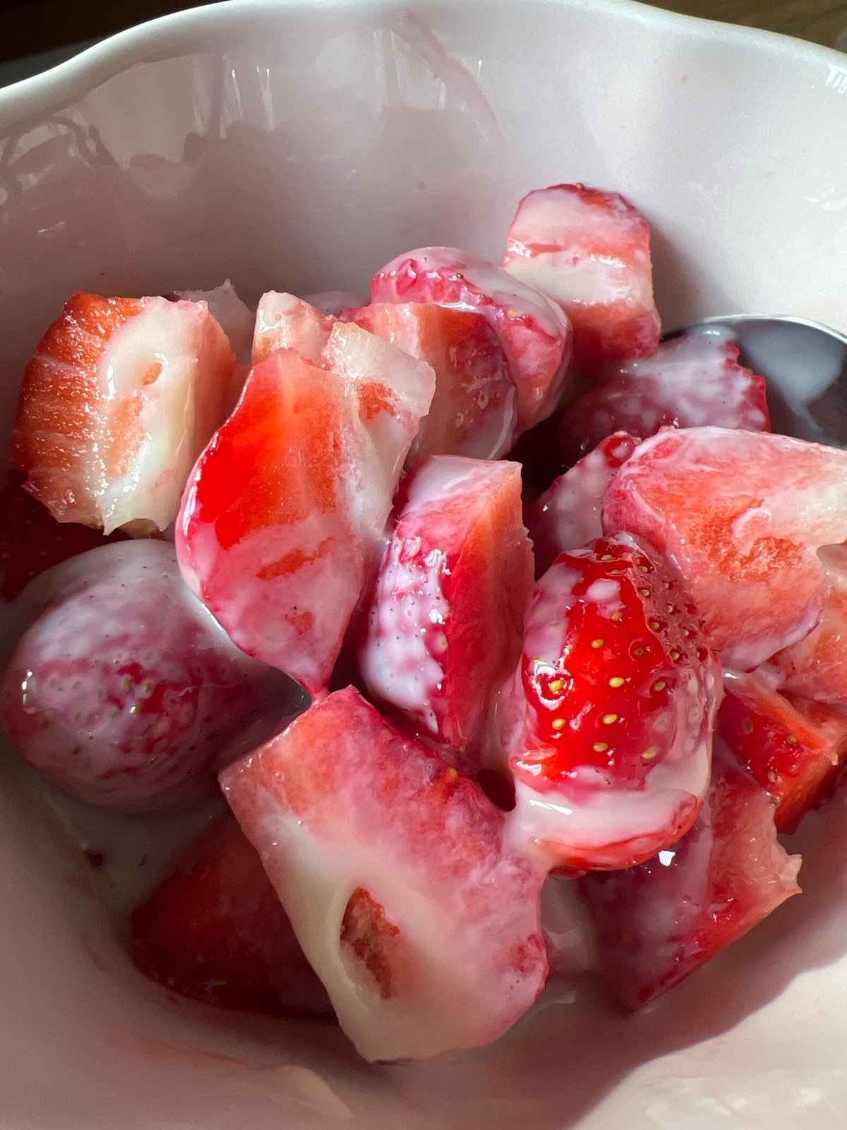 Irkutsk resident enjoys fresh strawberries with cream indoors