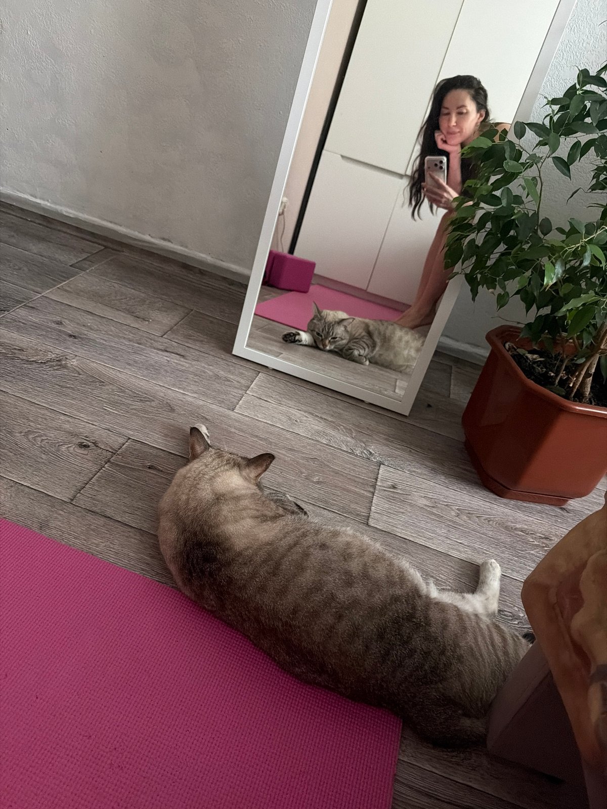 Woman in athletic wear rests indoors in Perm